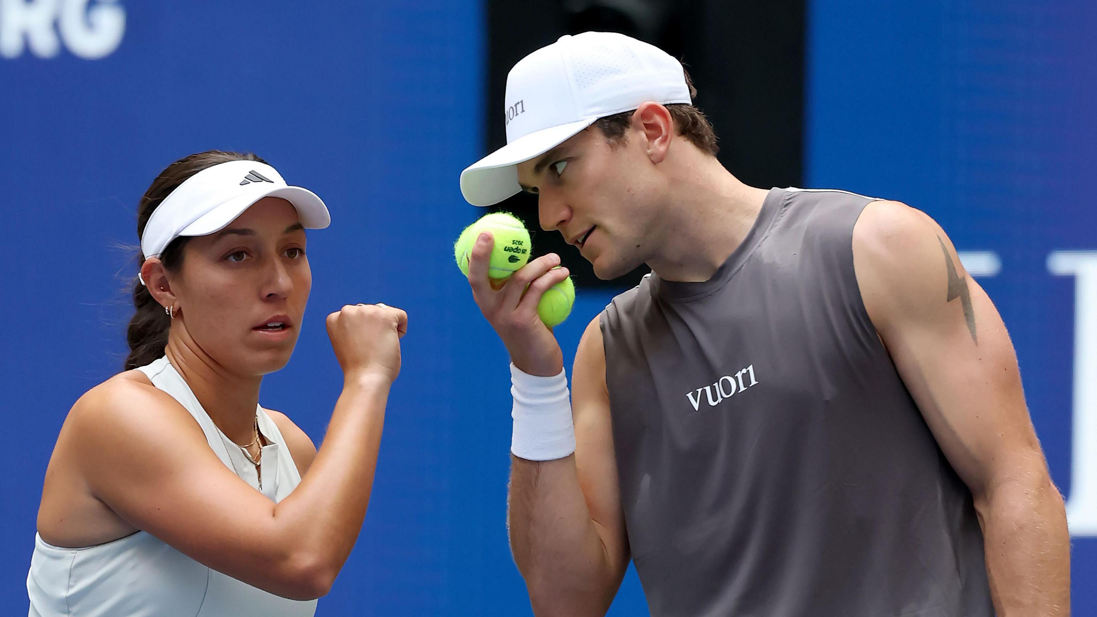 Jack Draper whispers tactics to mixed doubles partner Jessica Pegula at the US Open