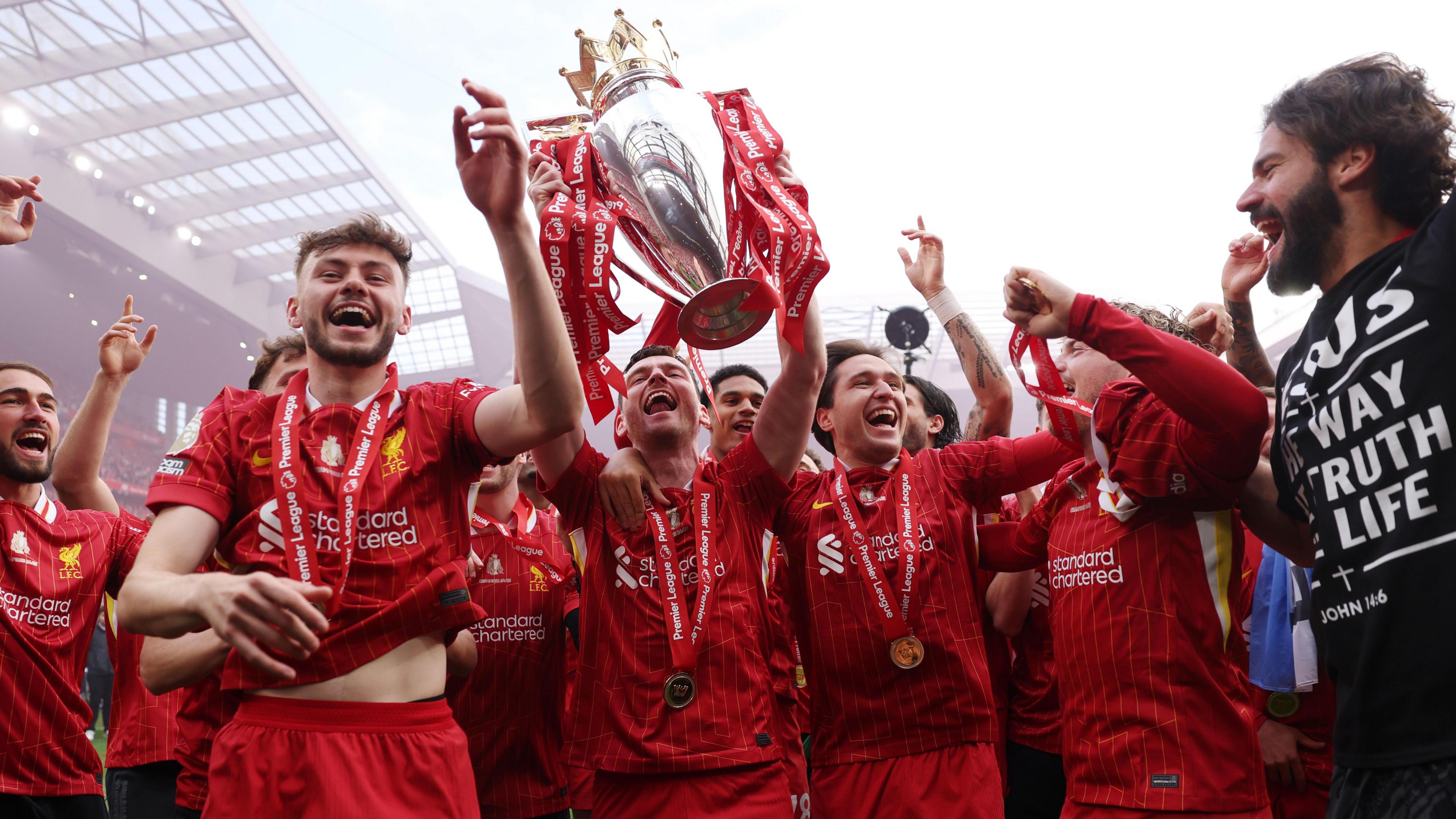 Conor Bradley celebrates winning the Premier League at Anfield