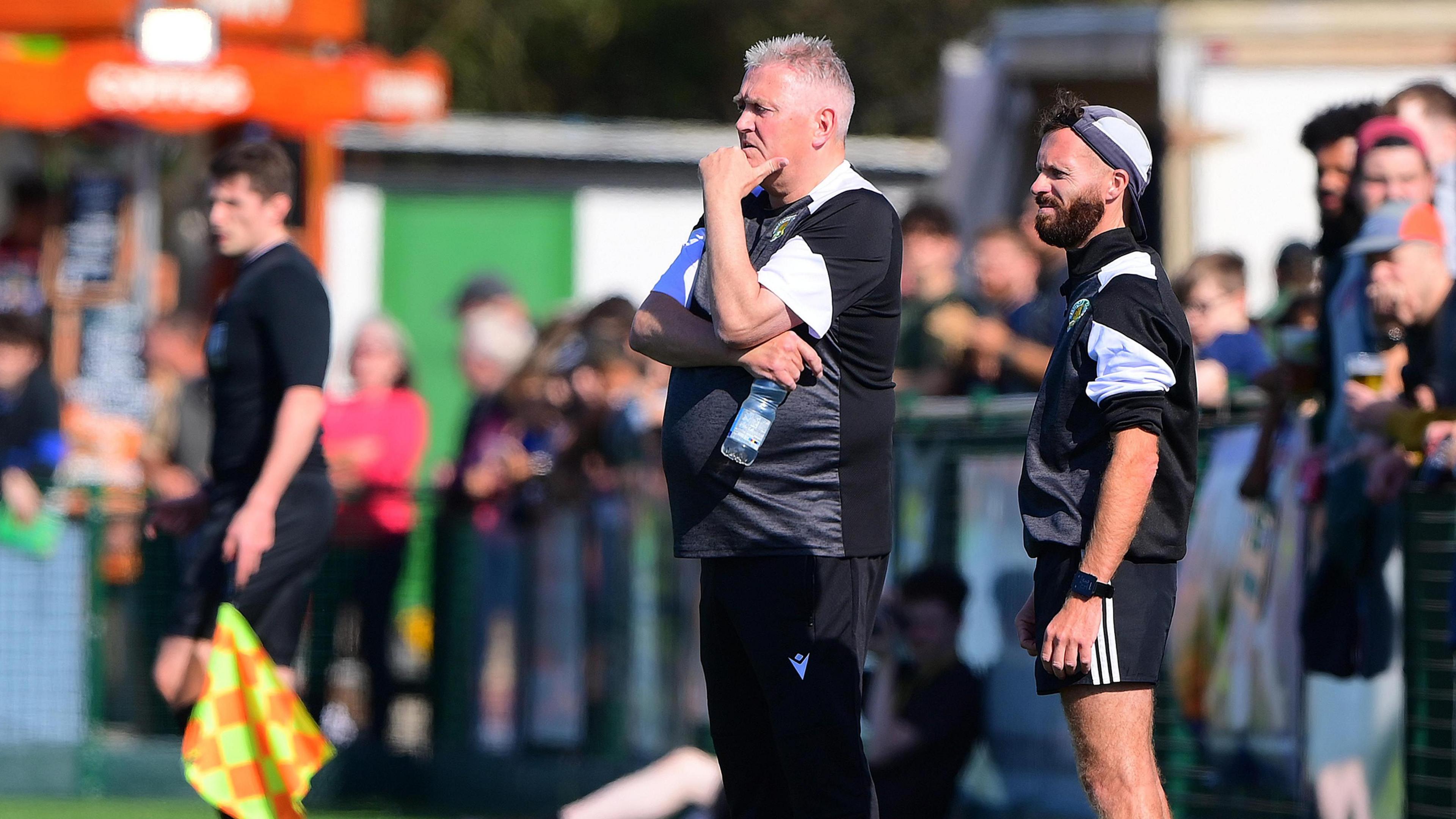 Bishops Cleeve manager Paul Collicutt is pictured on the touchline.