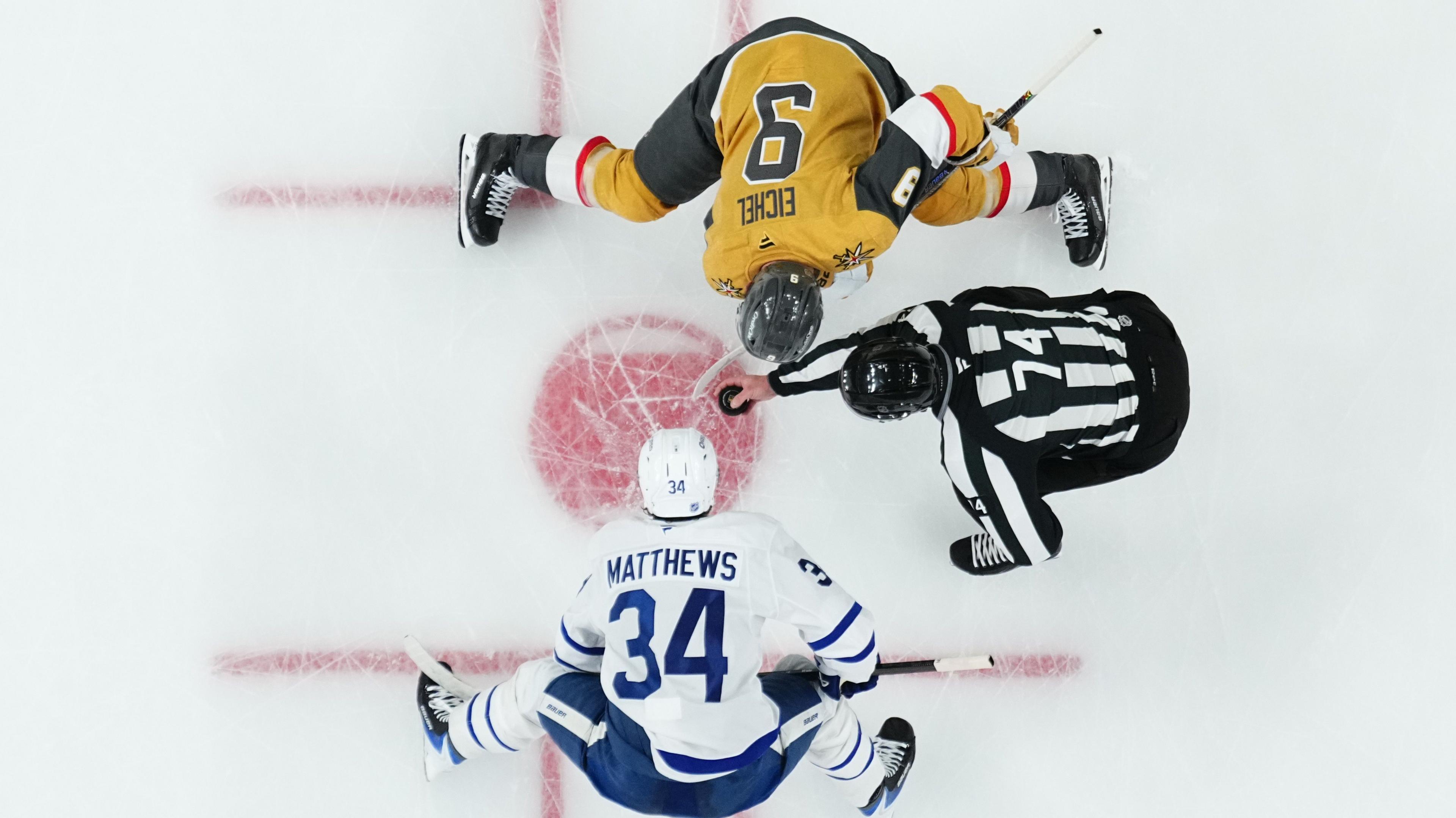 Jack Eichel #9 of the Vegas Golden Knights faces off against Auston Matthews #34 of the Toronto Maple Leafs during the second period at T-Mobile Arena 