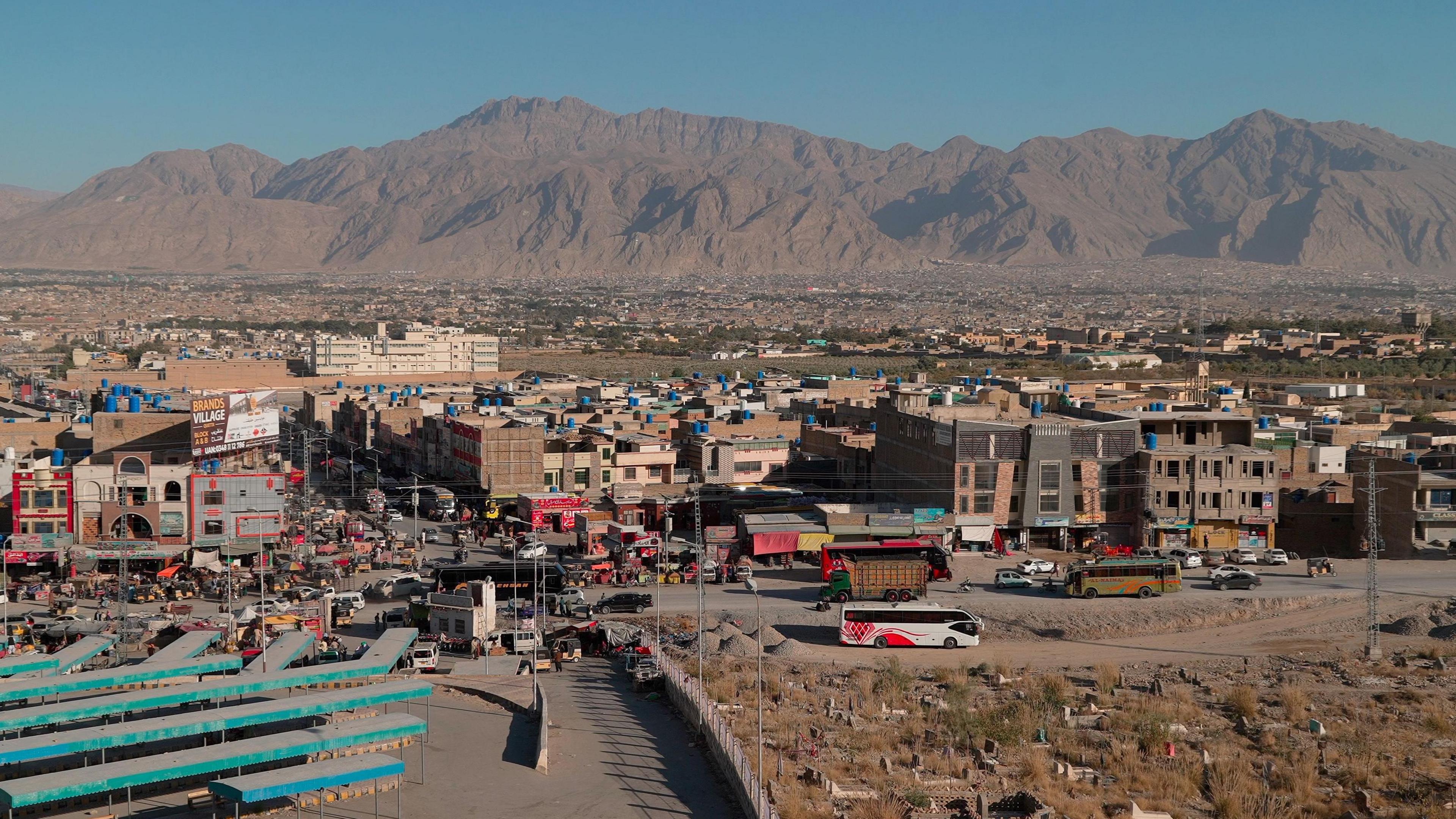 An aerial view of Quetta with mountains seen in the distance