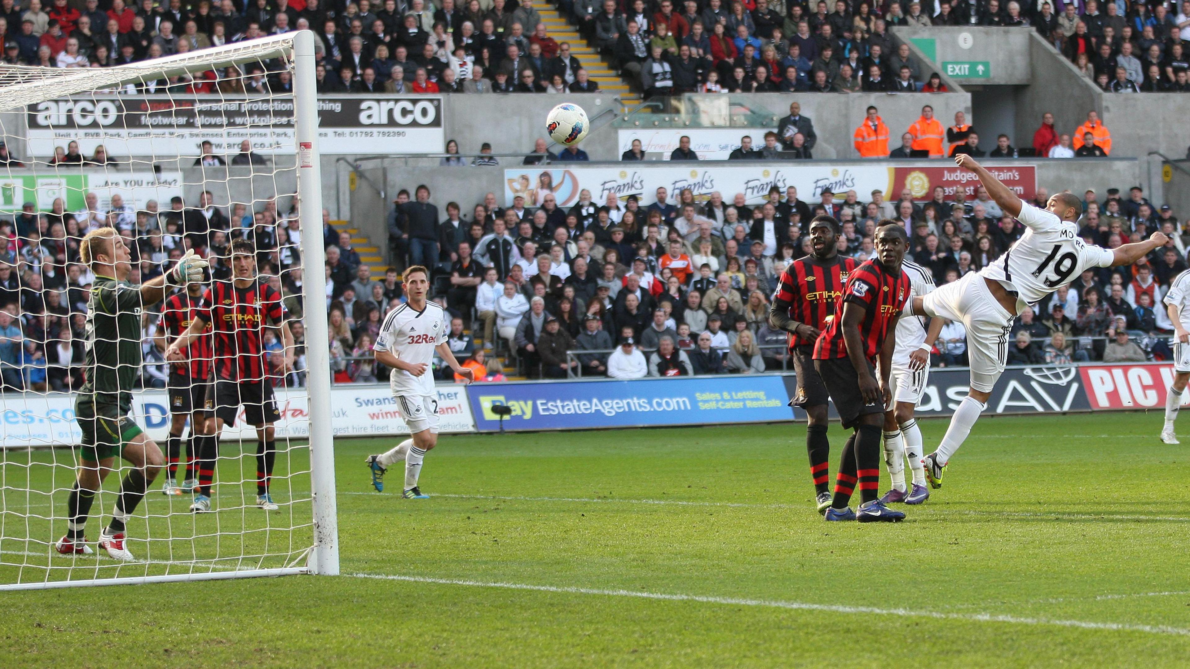 Luke Moore heads in Swansea's winning goal