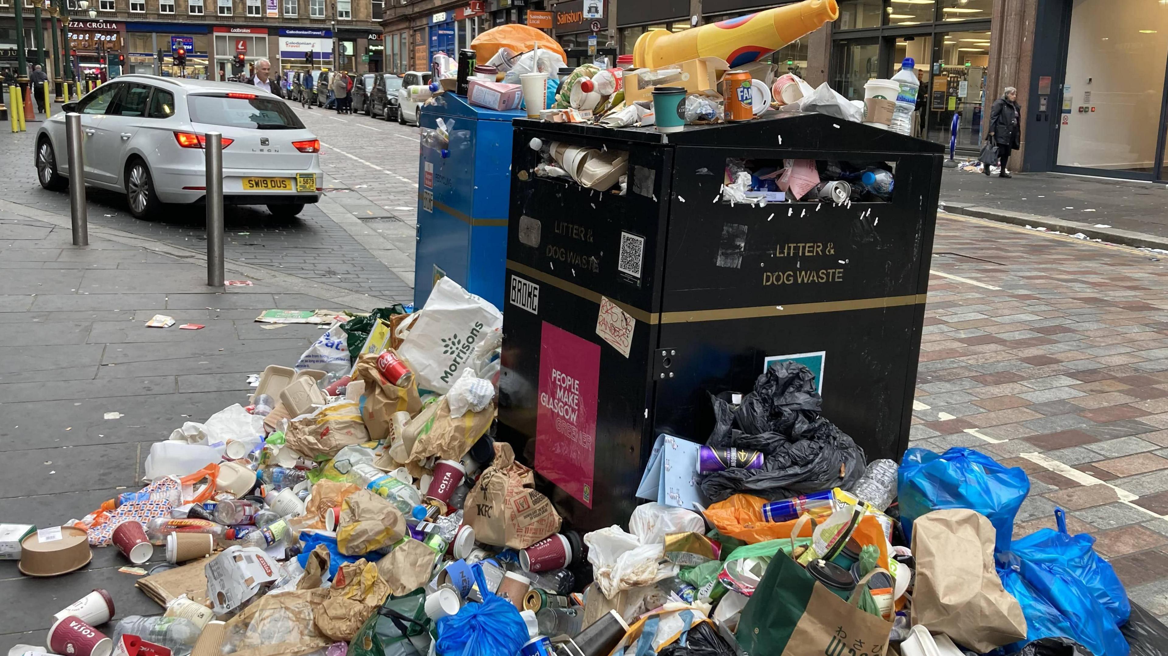 Overflowing rubbish bin