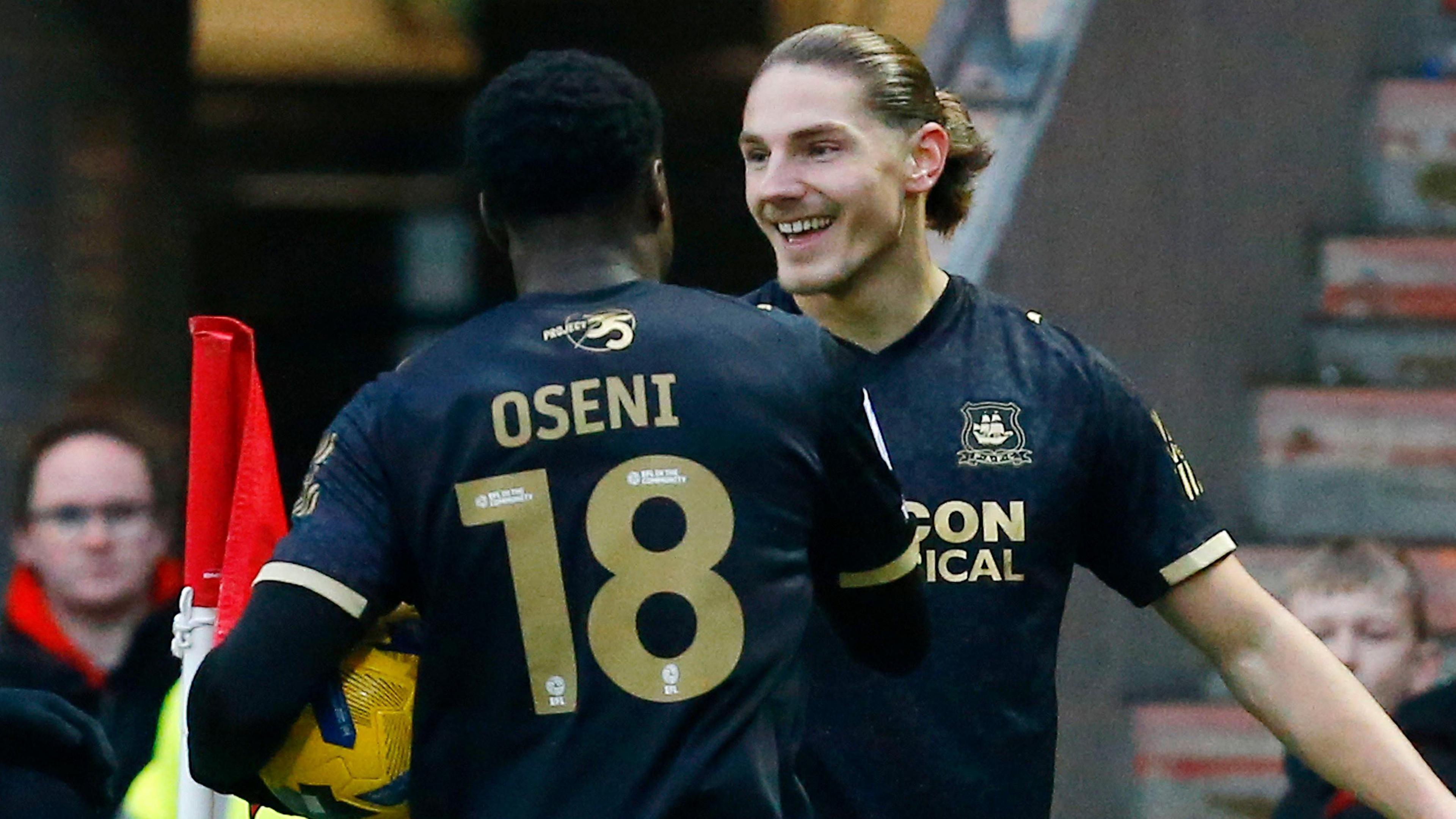 Lorent Tolaj and Owen Oseni celebrate