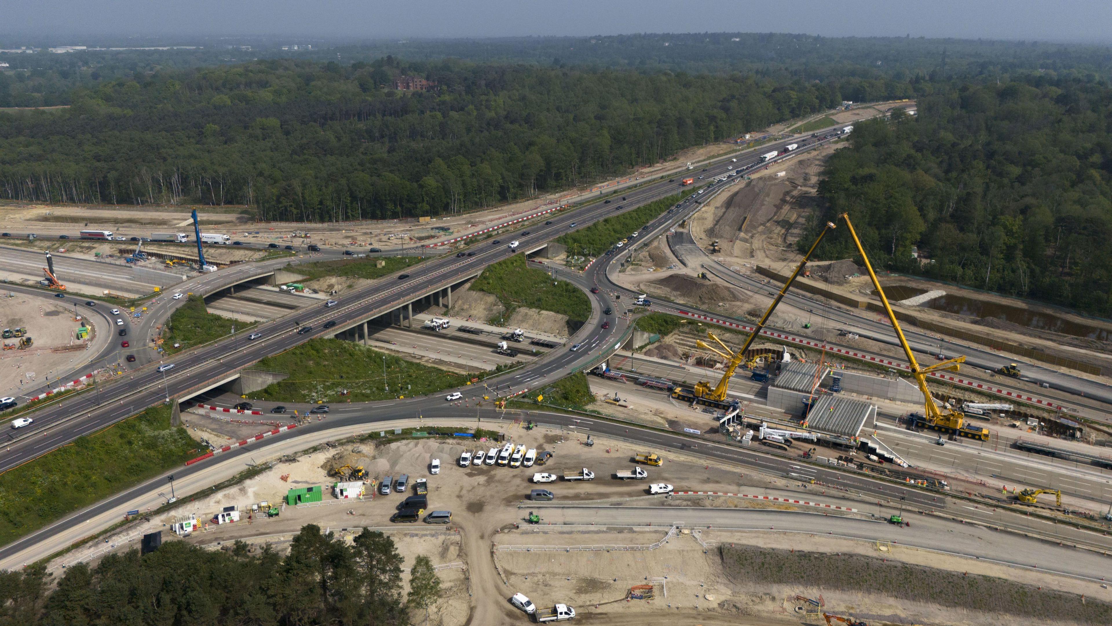 An aerial view of the M25/A3 junction, showing roadworks being carried out and traffic being diverted off the carriageways.