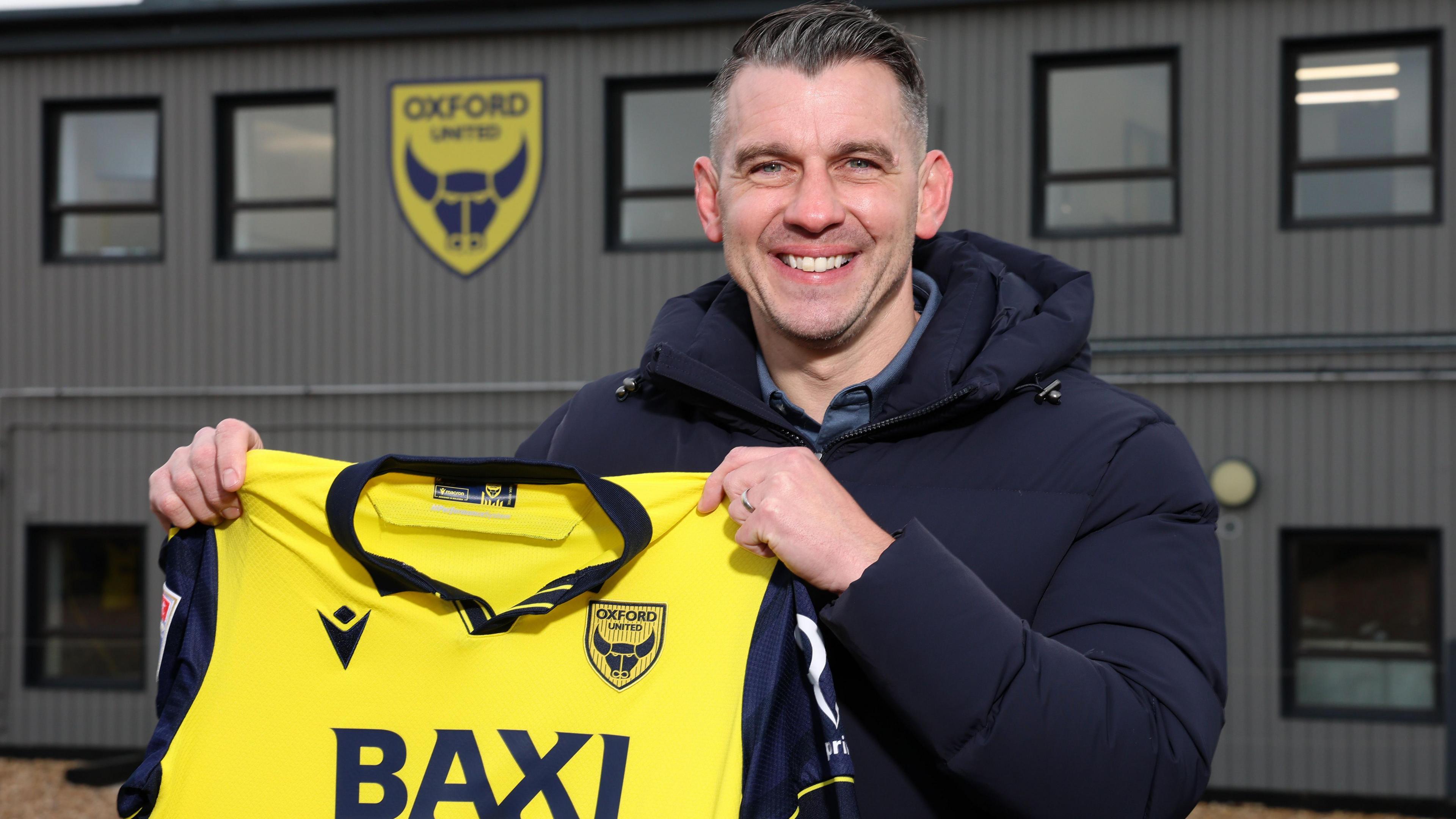 Matt Bloomfield, pictured holding an Oxford shirt