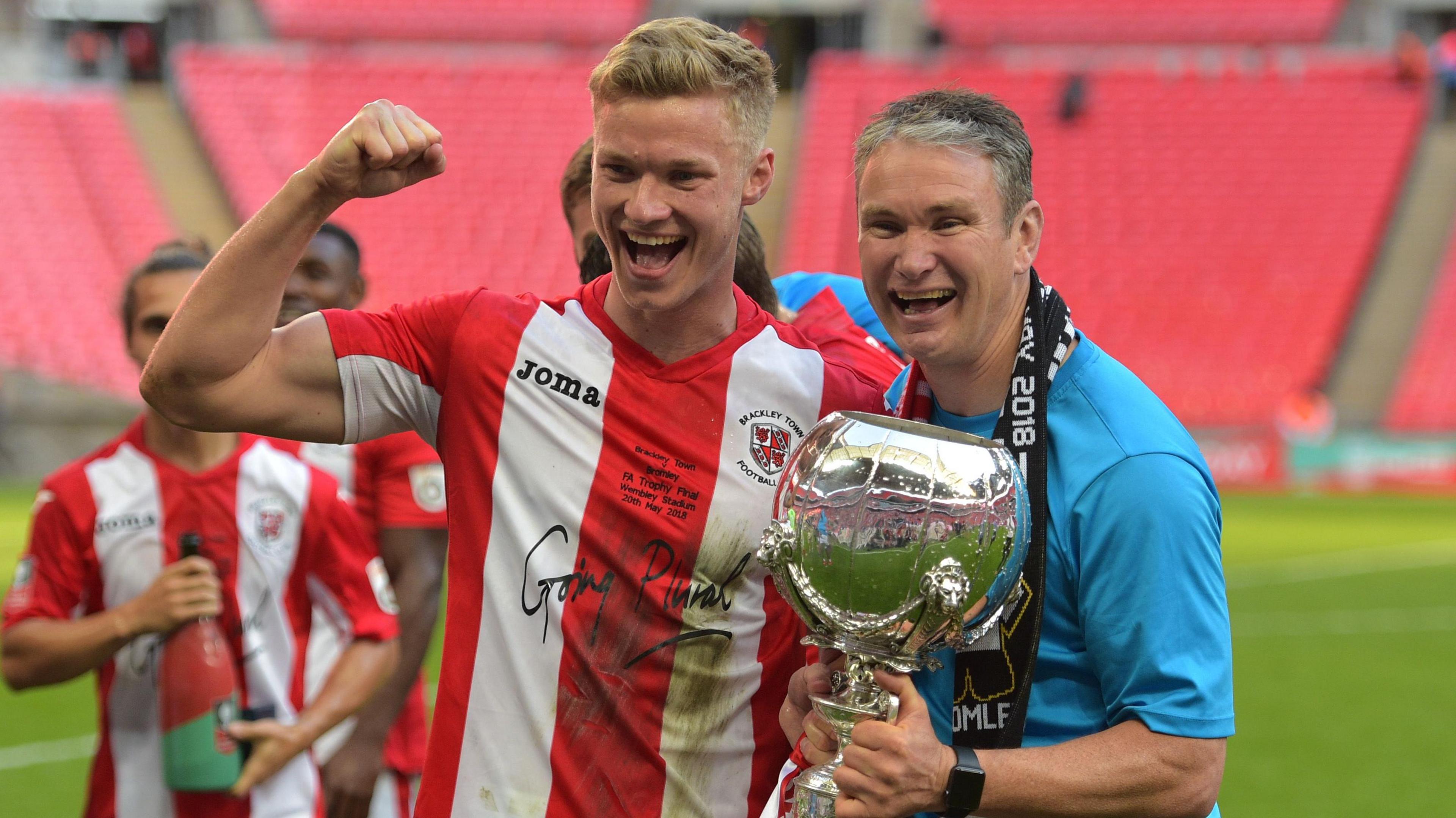 Gareth Dean and former Brackley boss Kevin Wilkin celebrate the club's 2018 FA Trophy win at Wembley