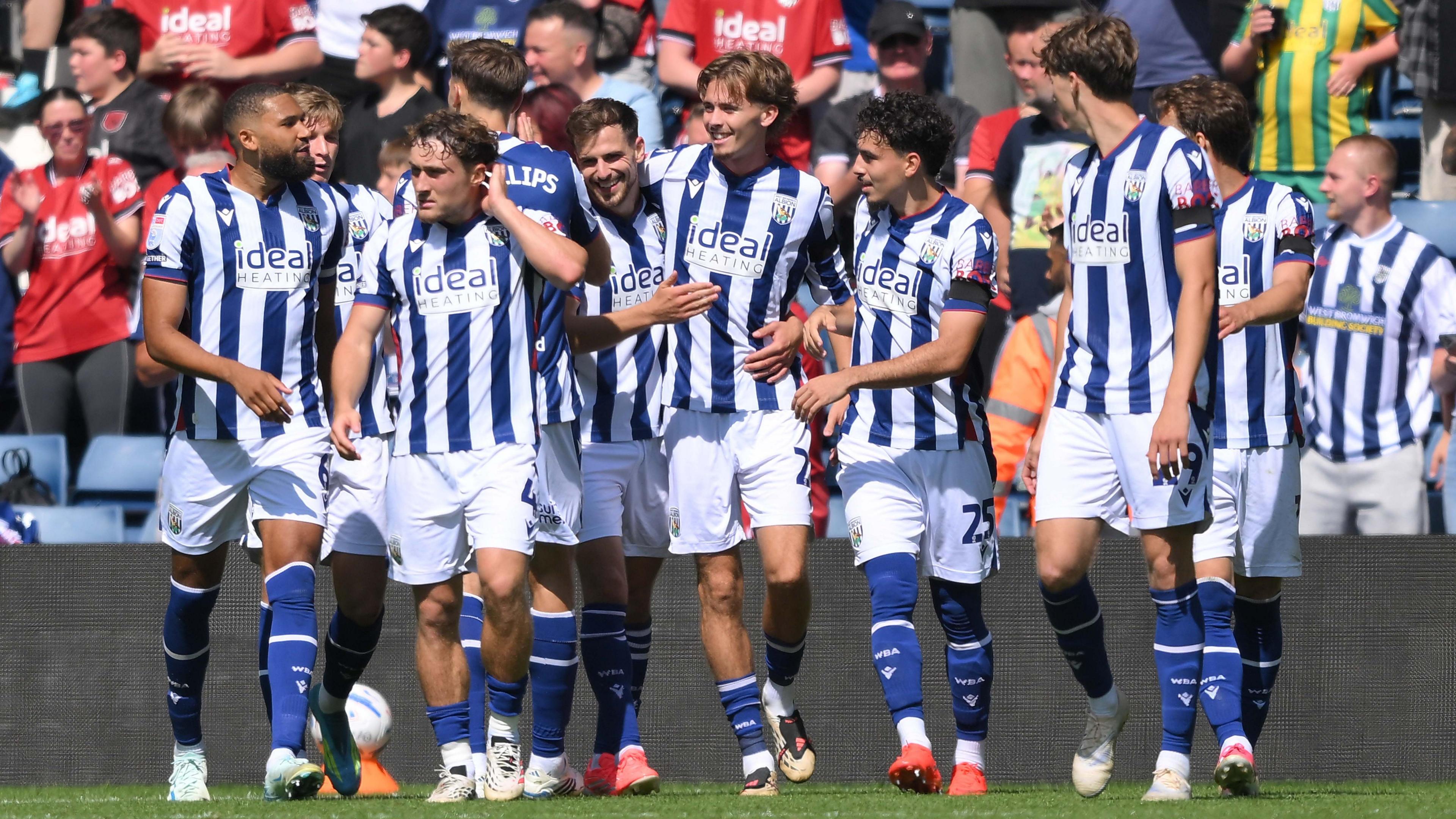 A smiling Isaac Price celebrates West Bromwich Albion's second goal with his team-mates against Burnley at The Hawthorns