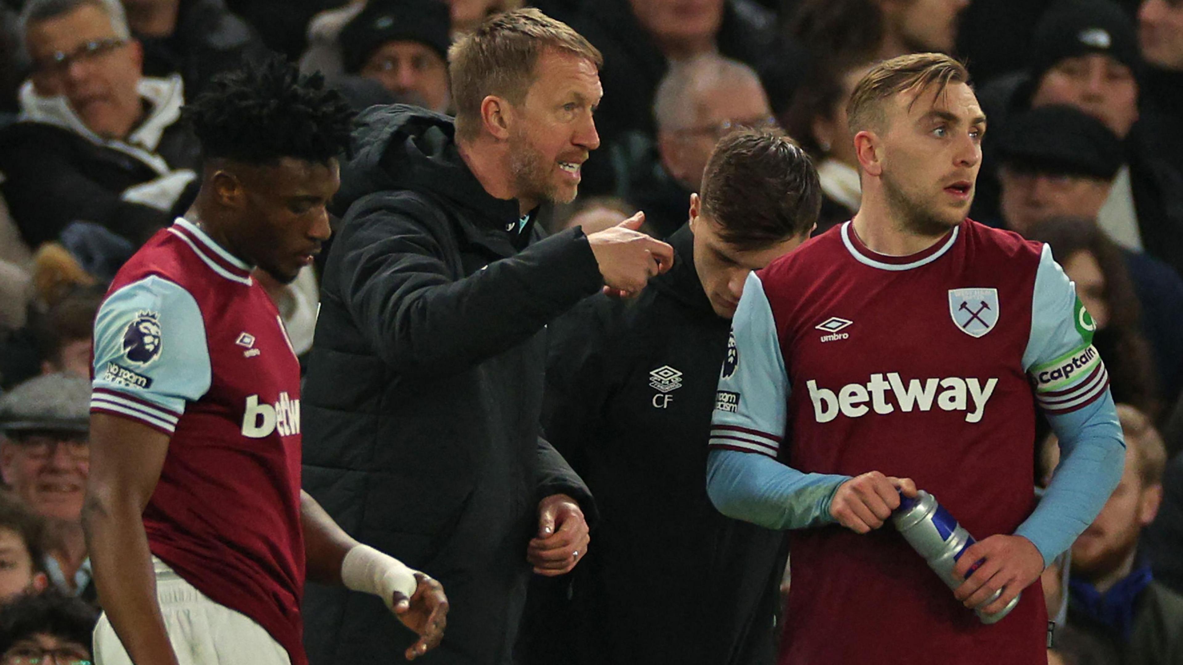 West Ham United head coach Graham Potter speaks with Jarrod Bowen during a break in play