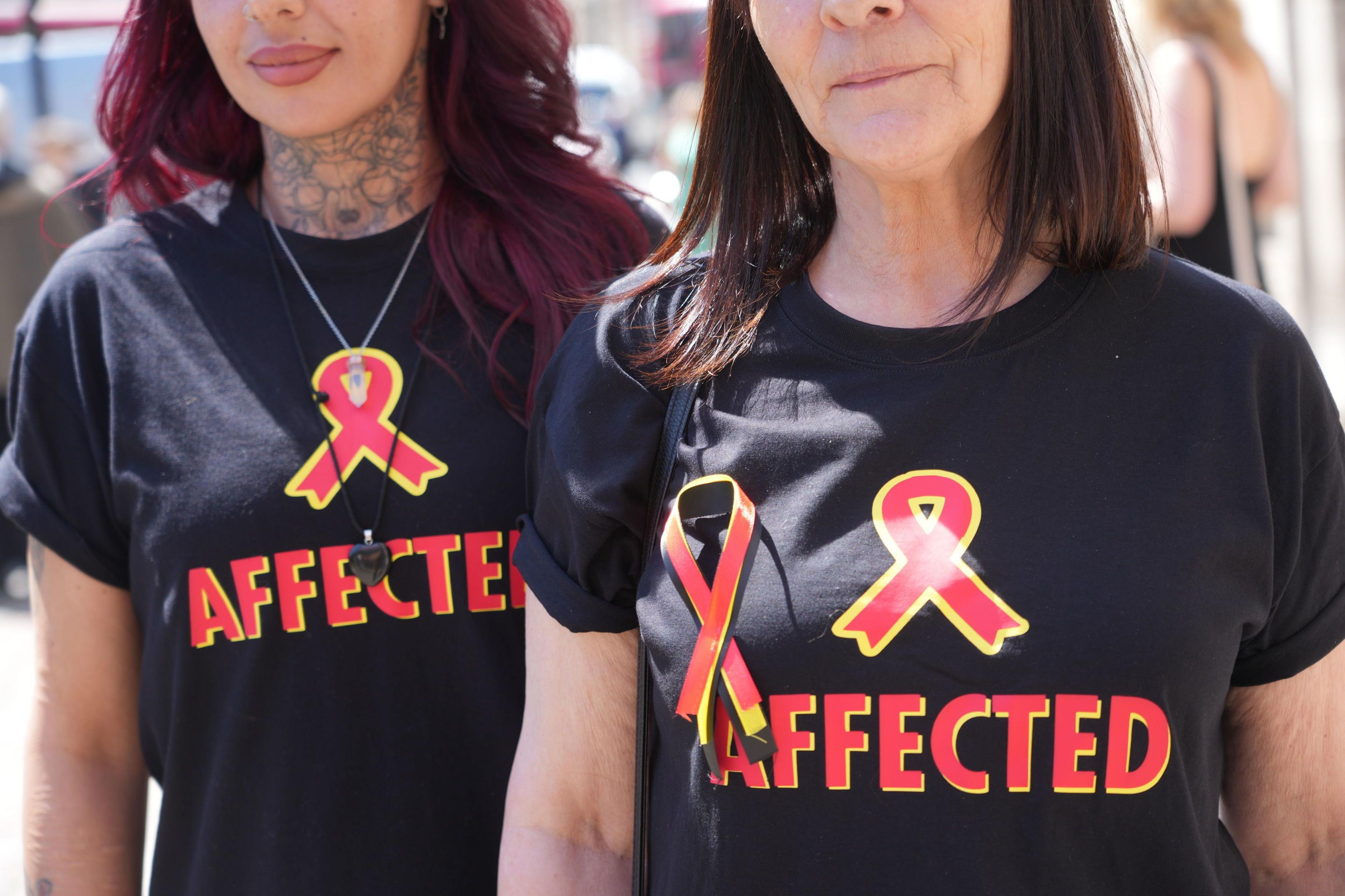 Victims and campaigners outside Central Hall in Westminster, London, after the publication of the Inquiry report. 