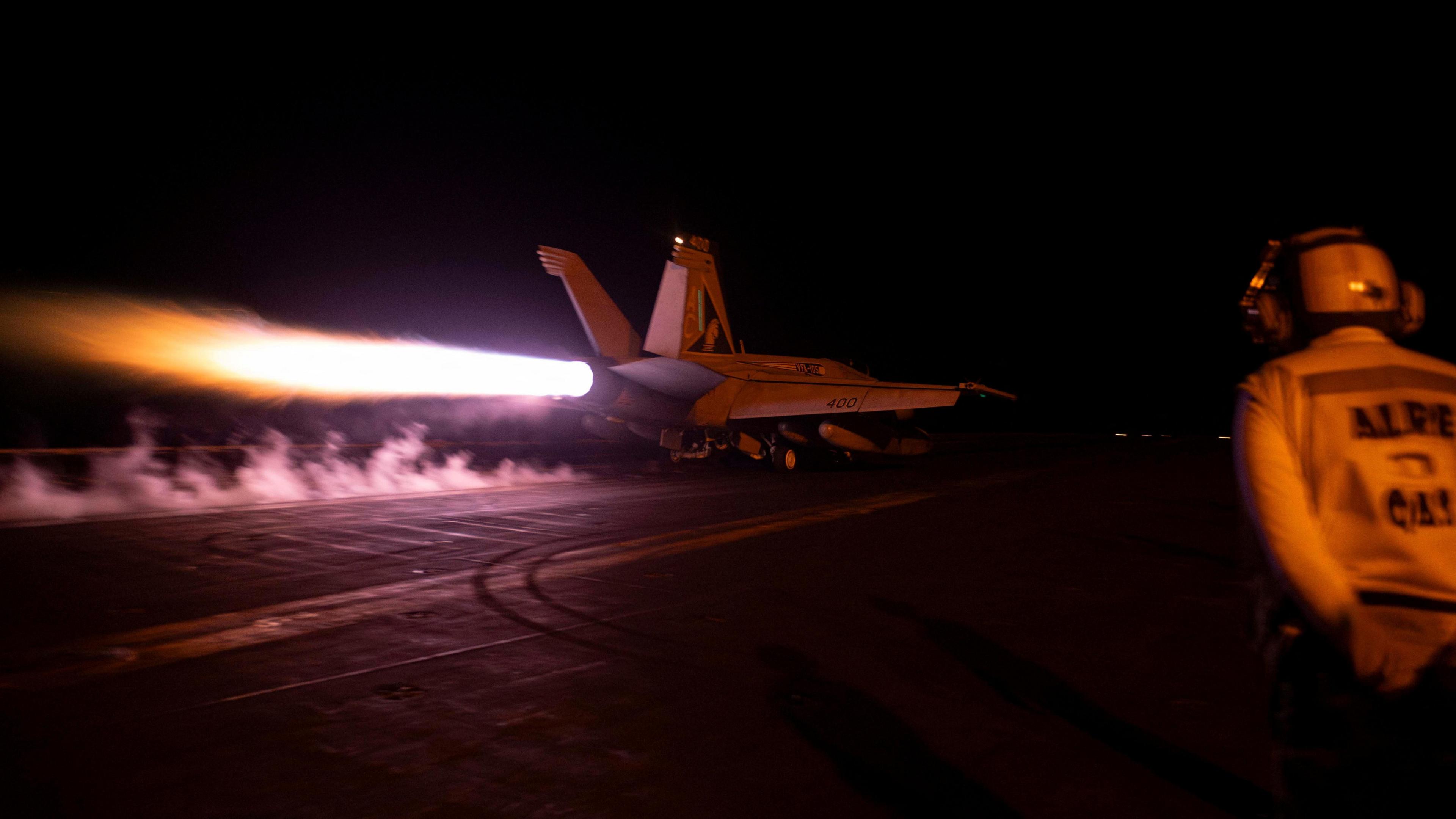 A fighter jet is launched from the U.S. Navy aircraft carrier USS Dwight D. Eisenhower during a strike against what the U.S. military describe as Houthi military targets in Yemen, February 3, 2024