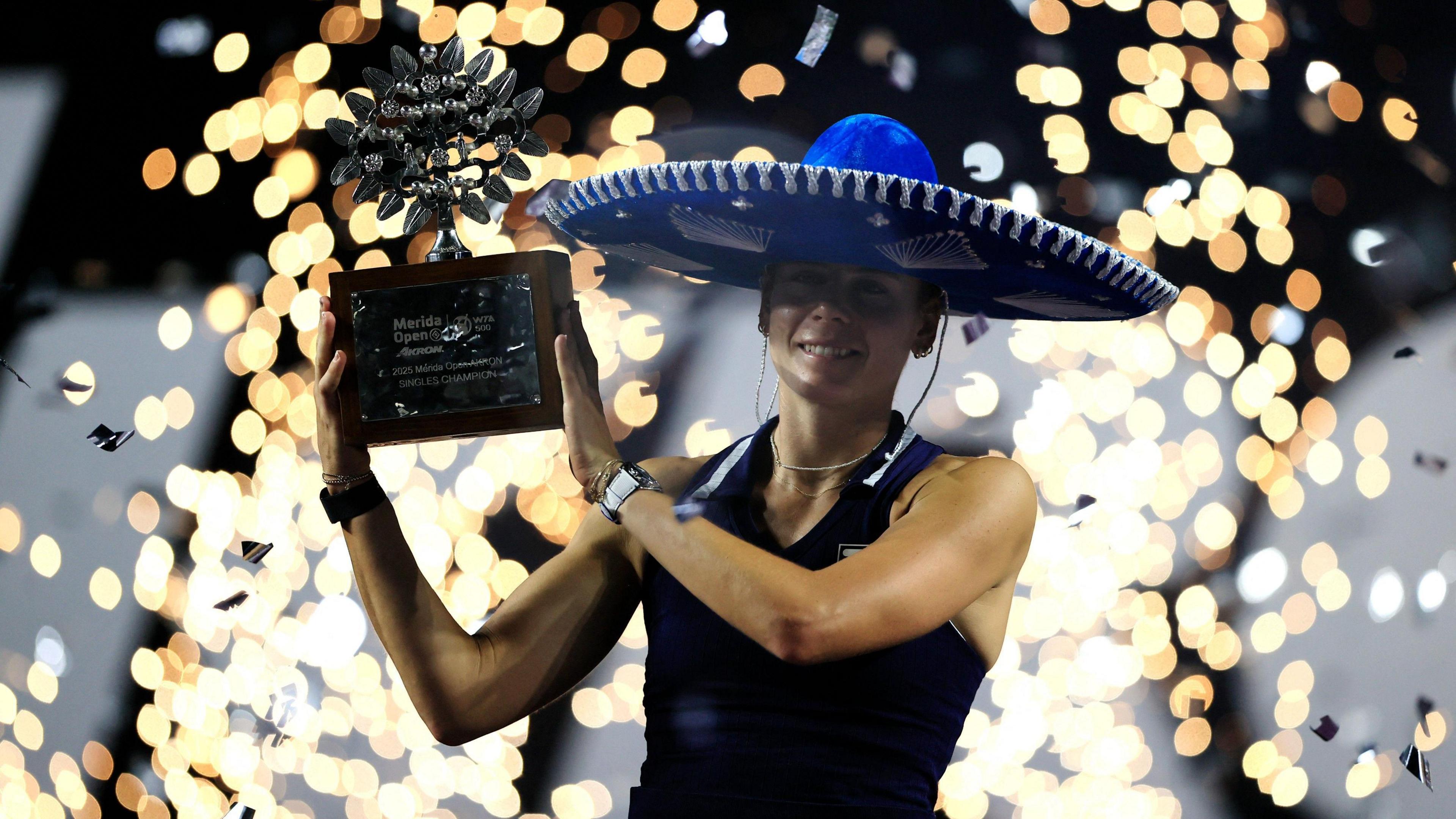 Emma Navarro holds her trophy up after winning the Merida Open