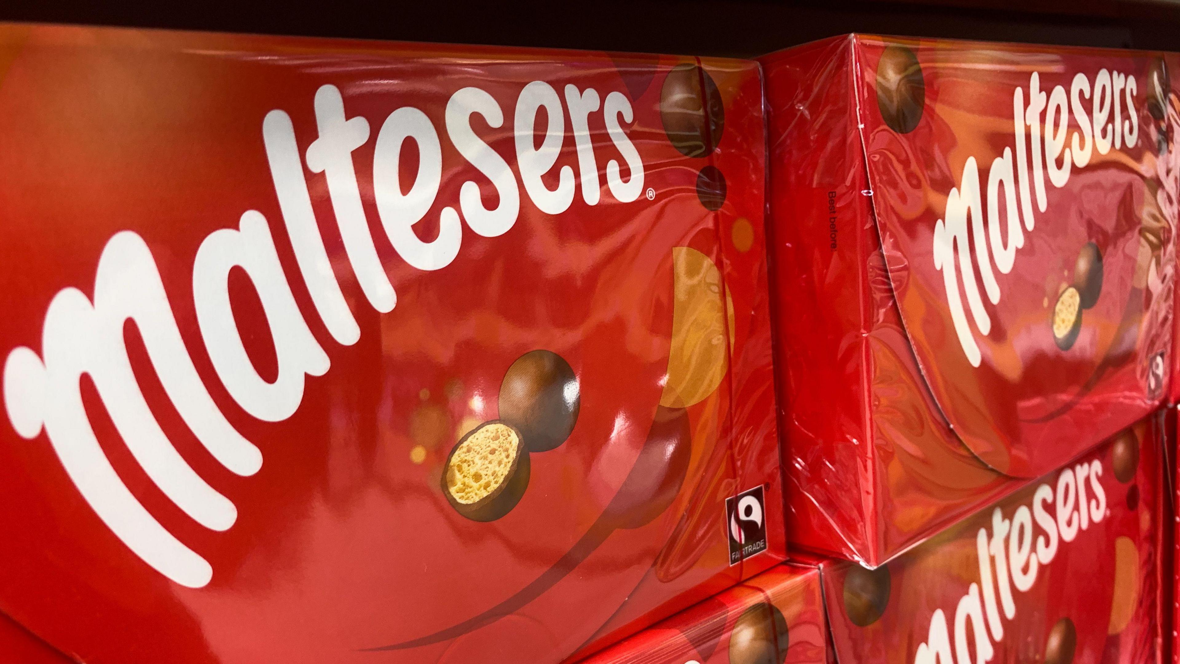 A red box of chocolates with the word Maltesers written on them 