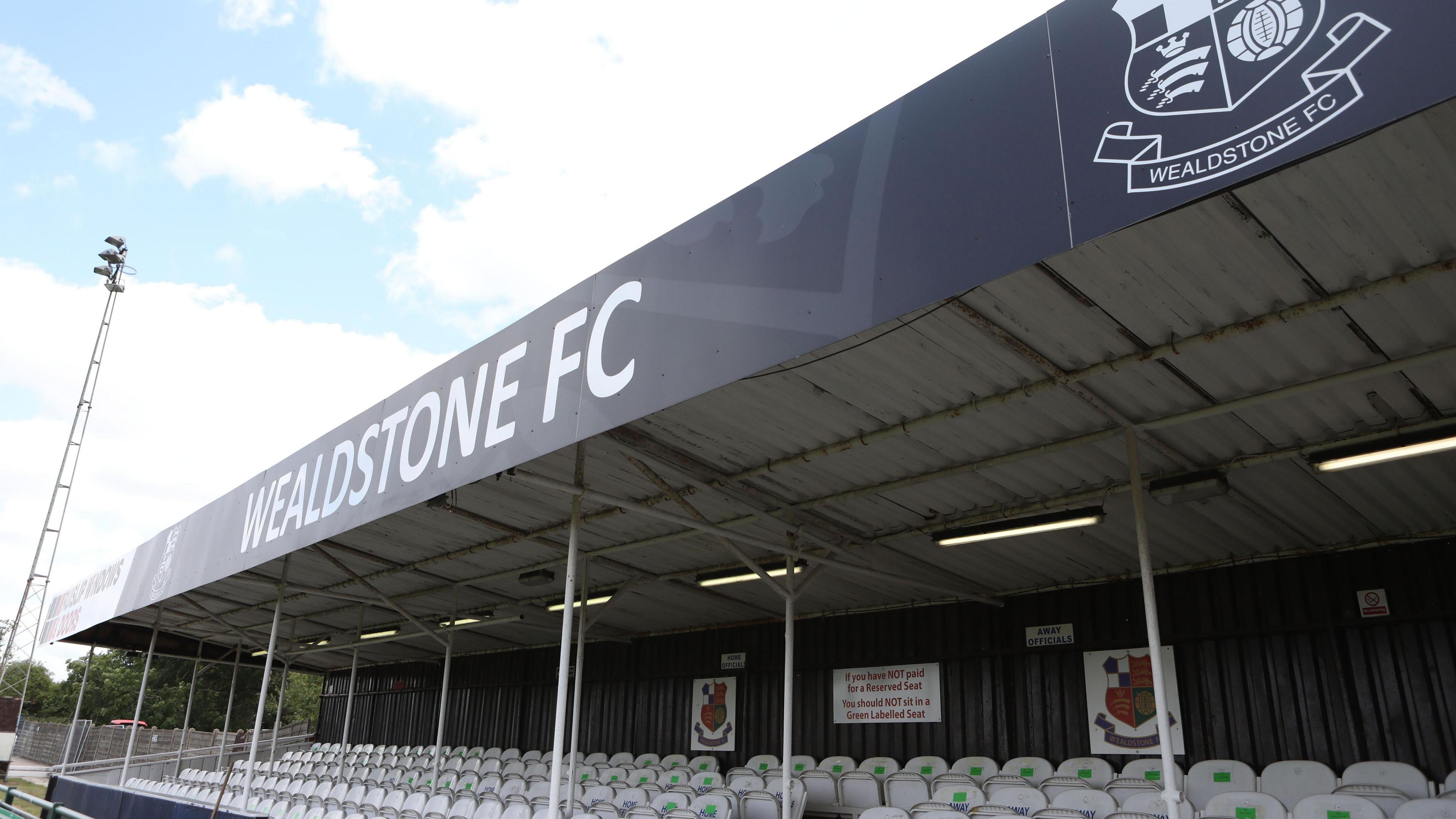 An empty stand at Grosvenor Vale on a sunny day