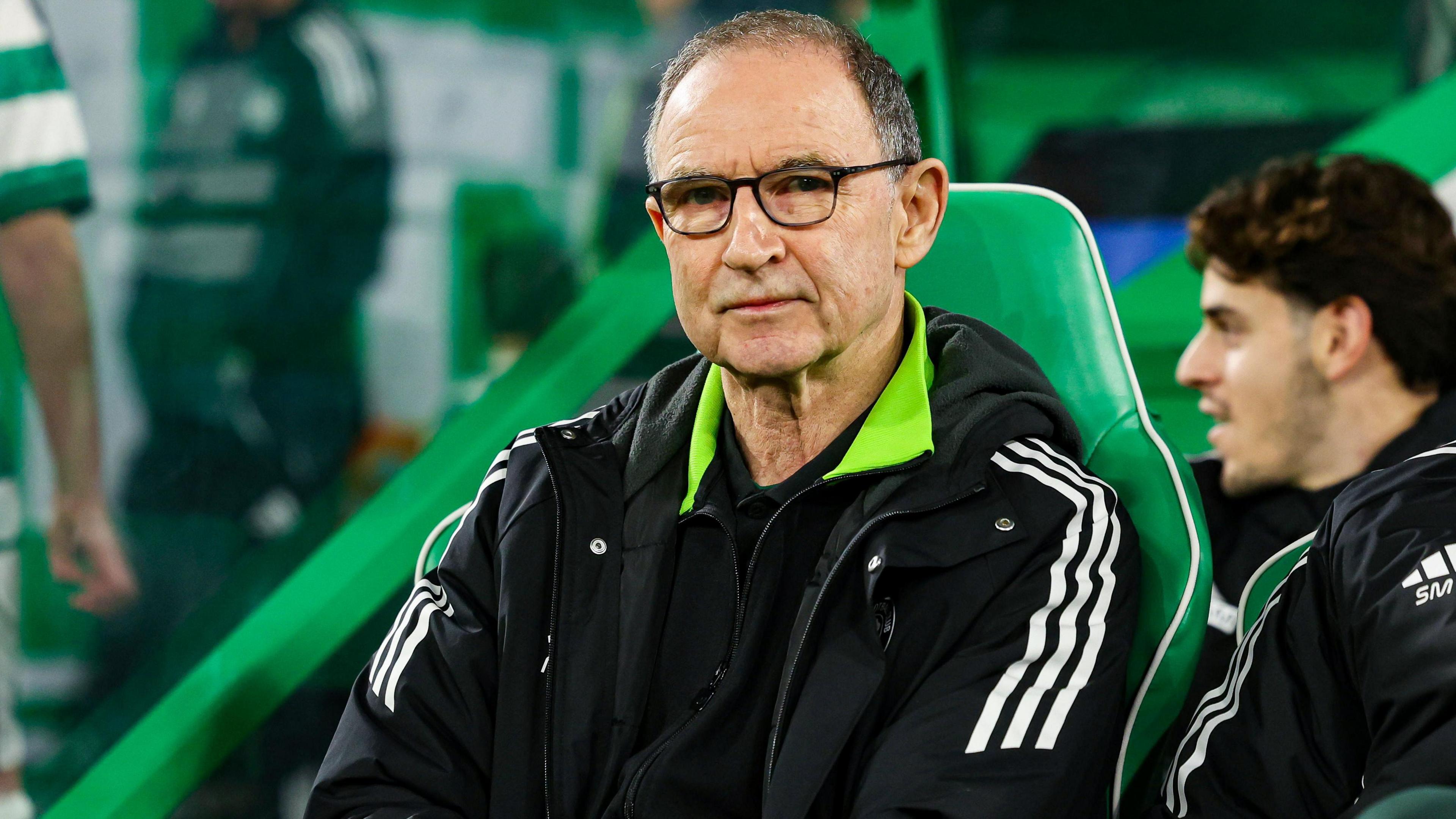 Martin O'Neill sitting in green seat as interim Celtic manager