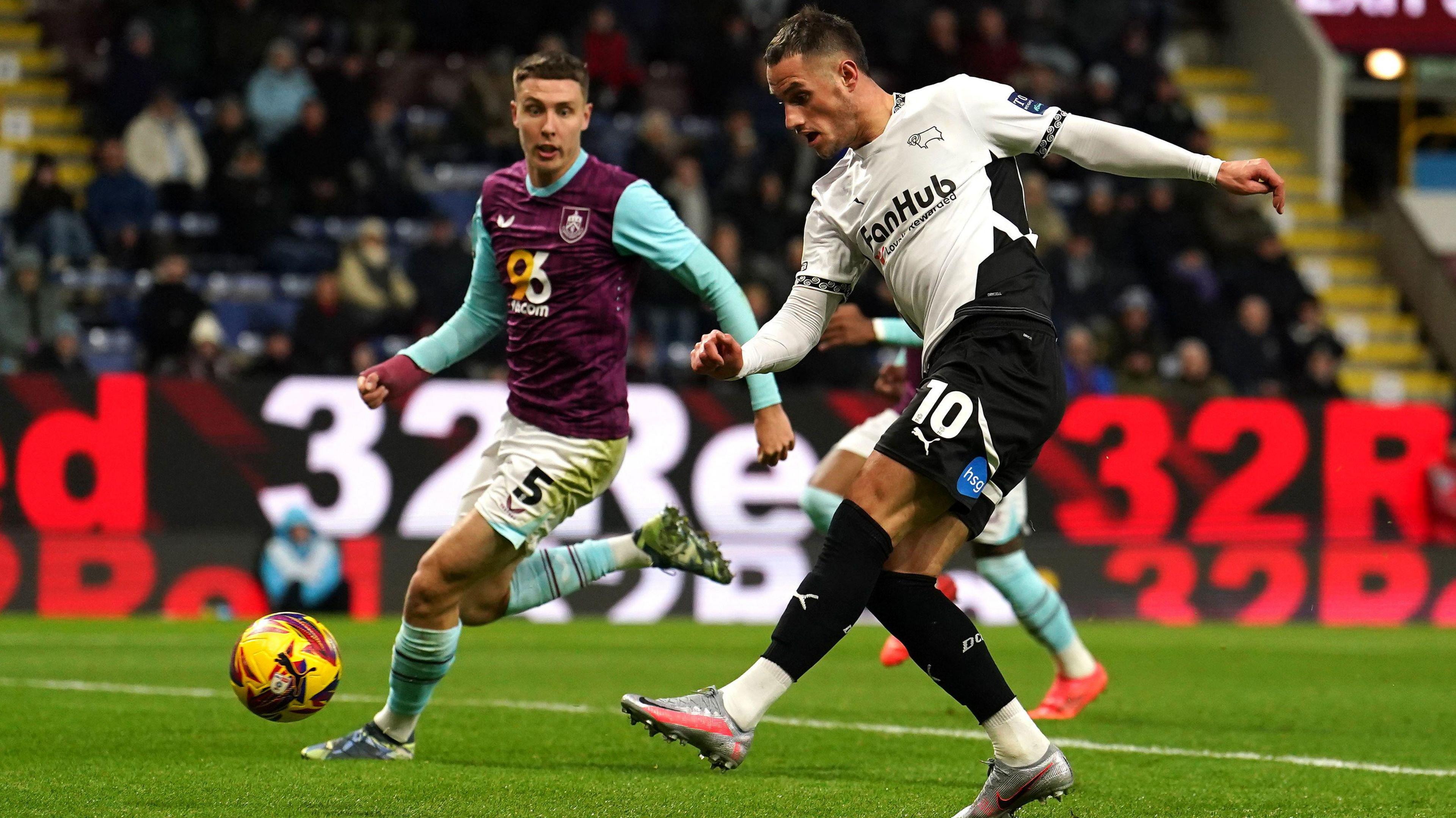 Derby County's Jerry Yates sees an effort saved by James Trafford