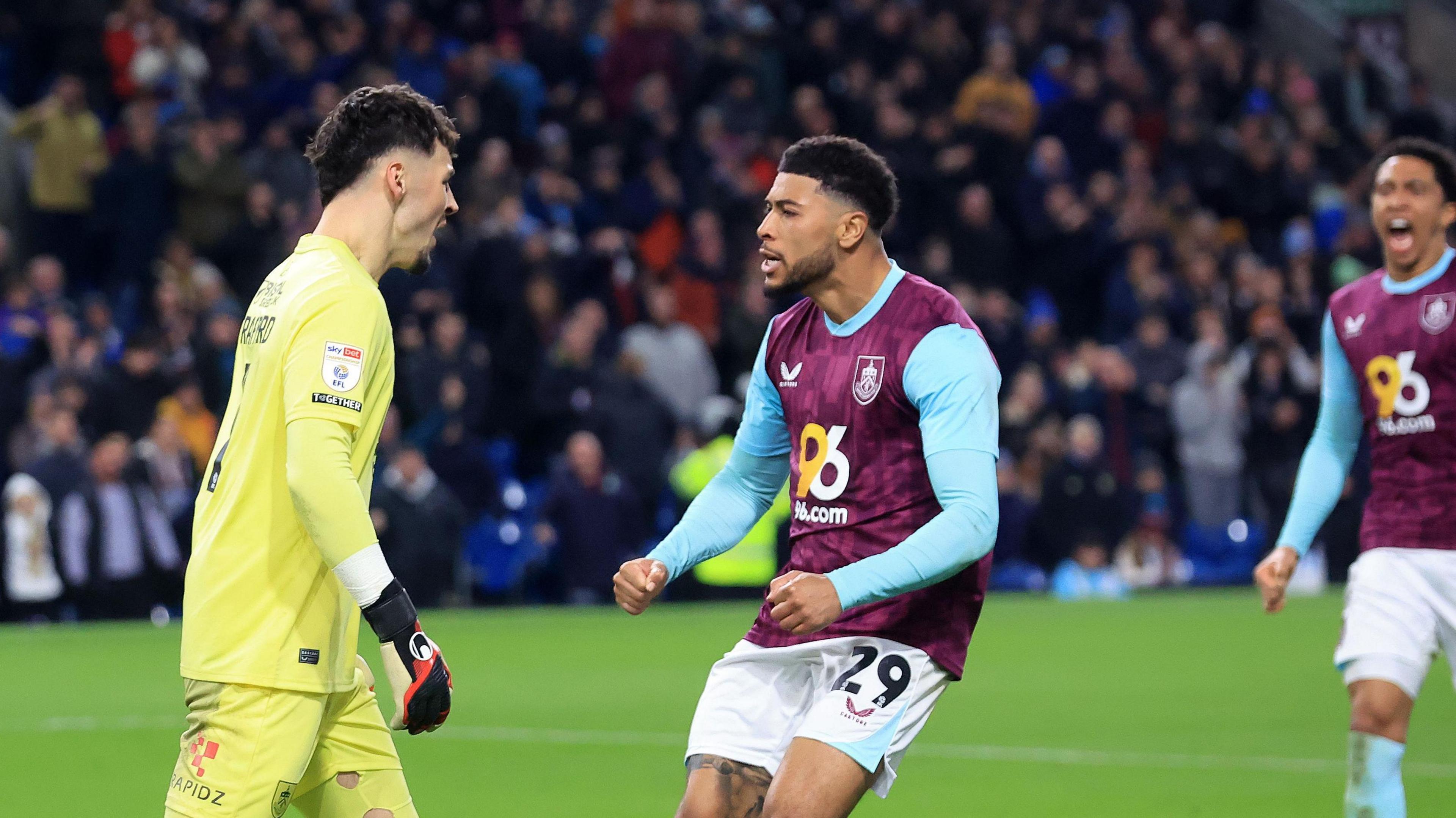 James Trafford and Josh Laurent celebrate one of his penalty saves