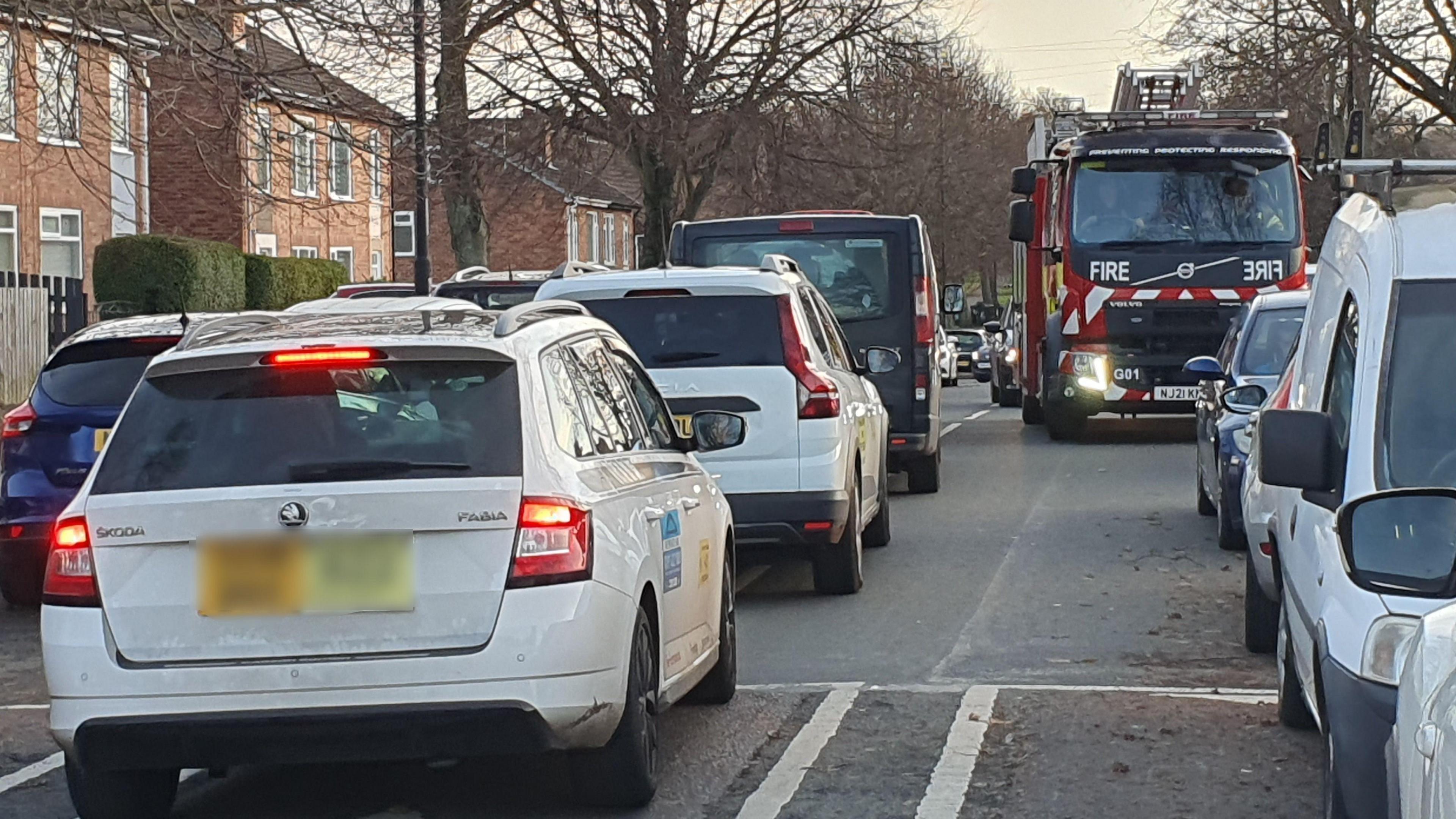 Fire engine struggling to get through road