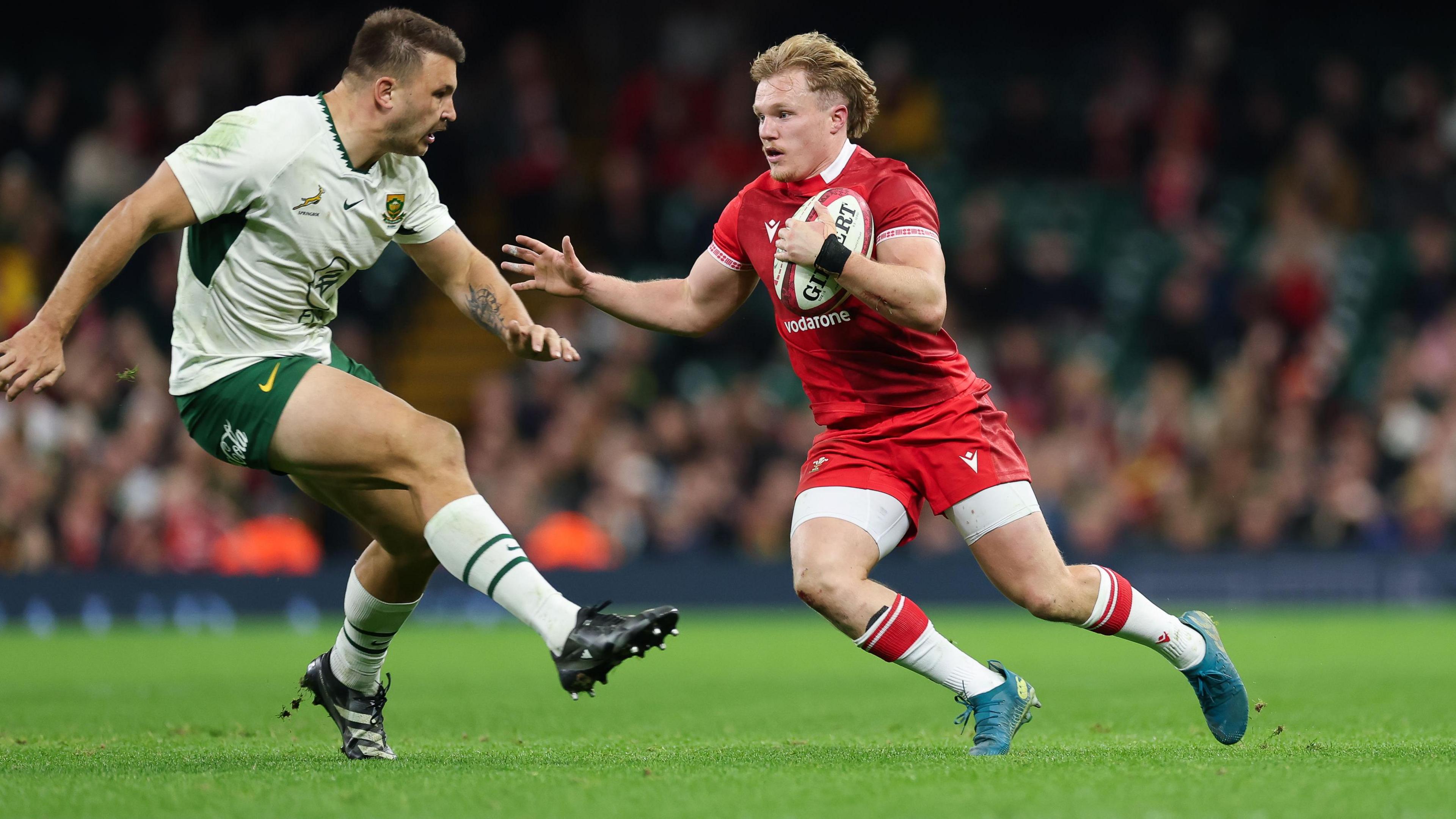 Wales full-back Blair Murray runs with the ball against South Africa