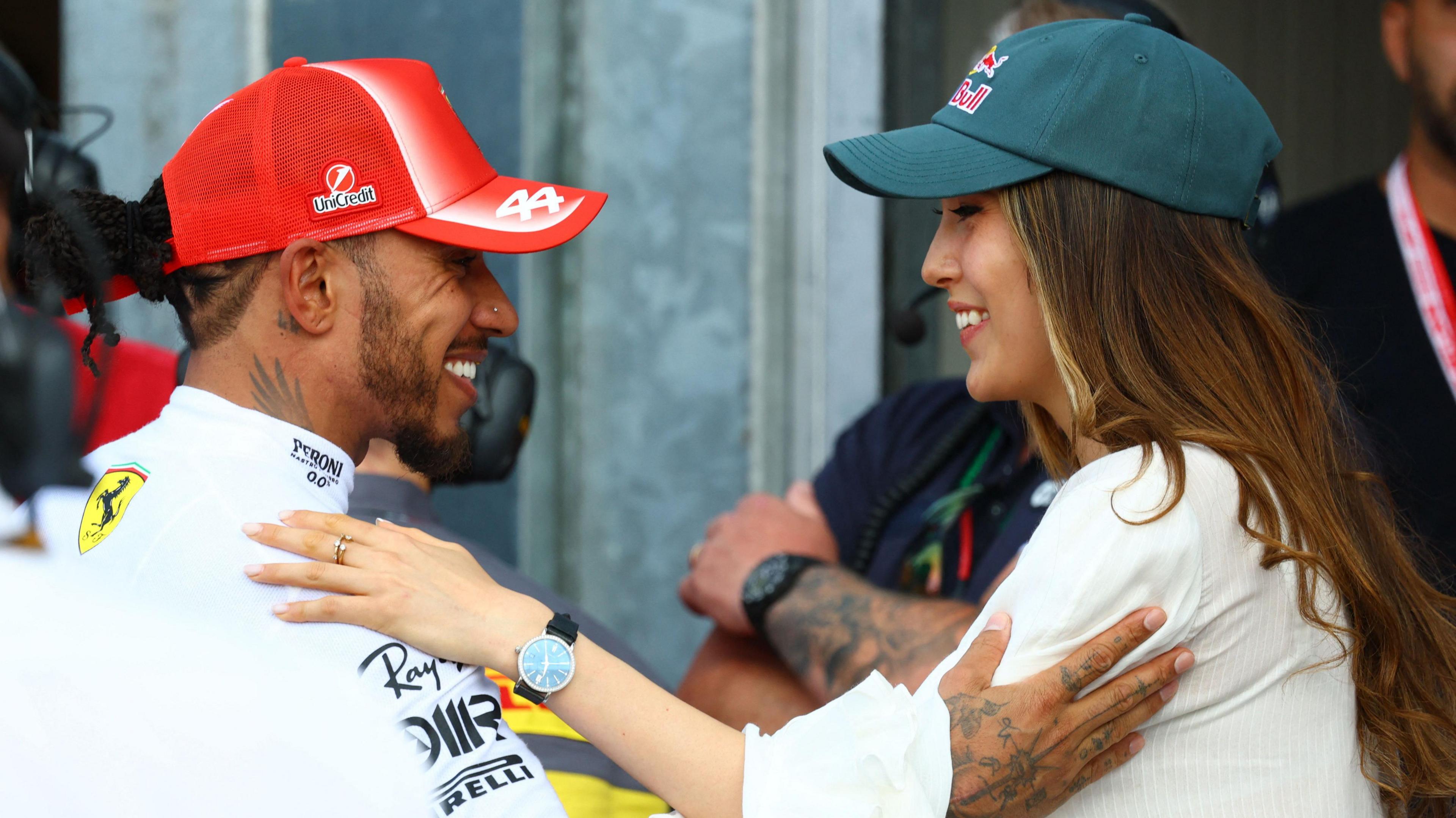 Ferrari's Lewis Hamilton with freestyle skier Eileen Gu after qualifying