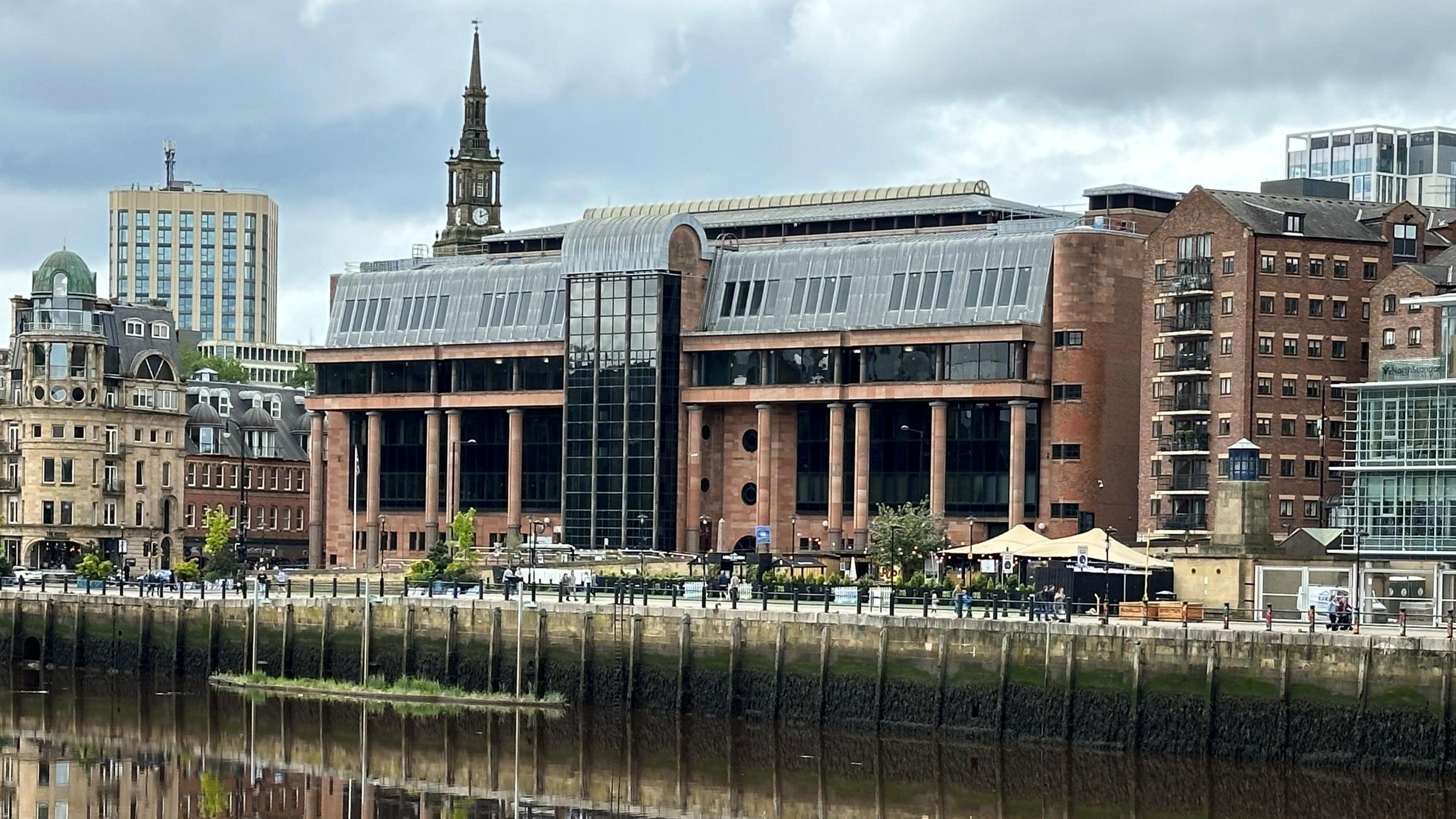 Large red court building from a distance