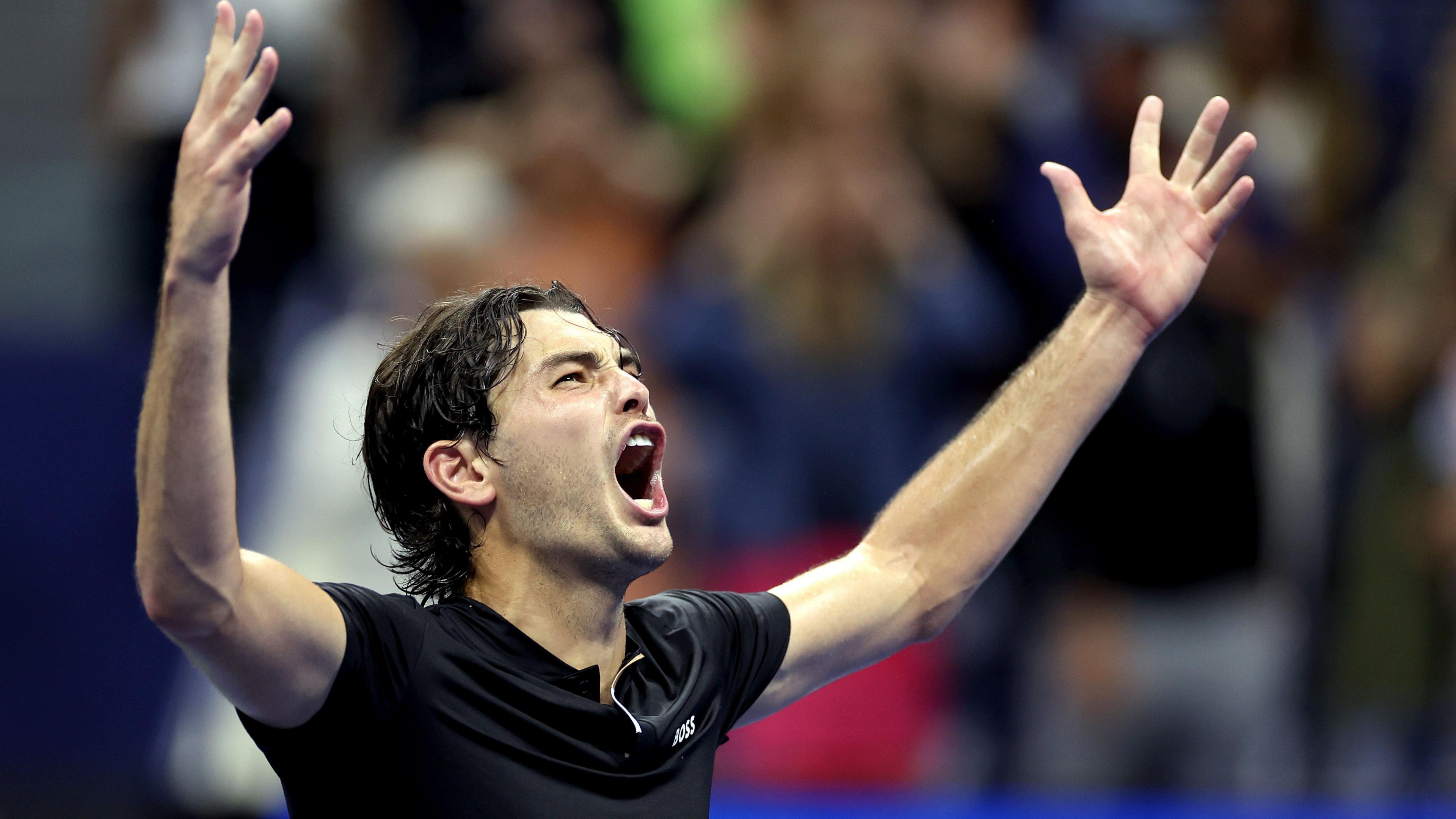 Taylor Fritz celebrates victory over Frances Tiafoe in the US Open