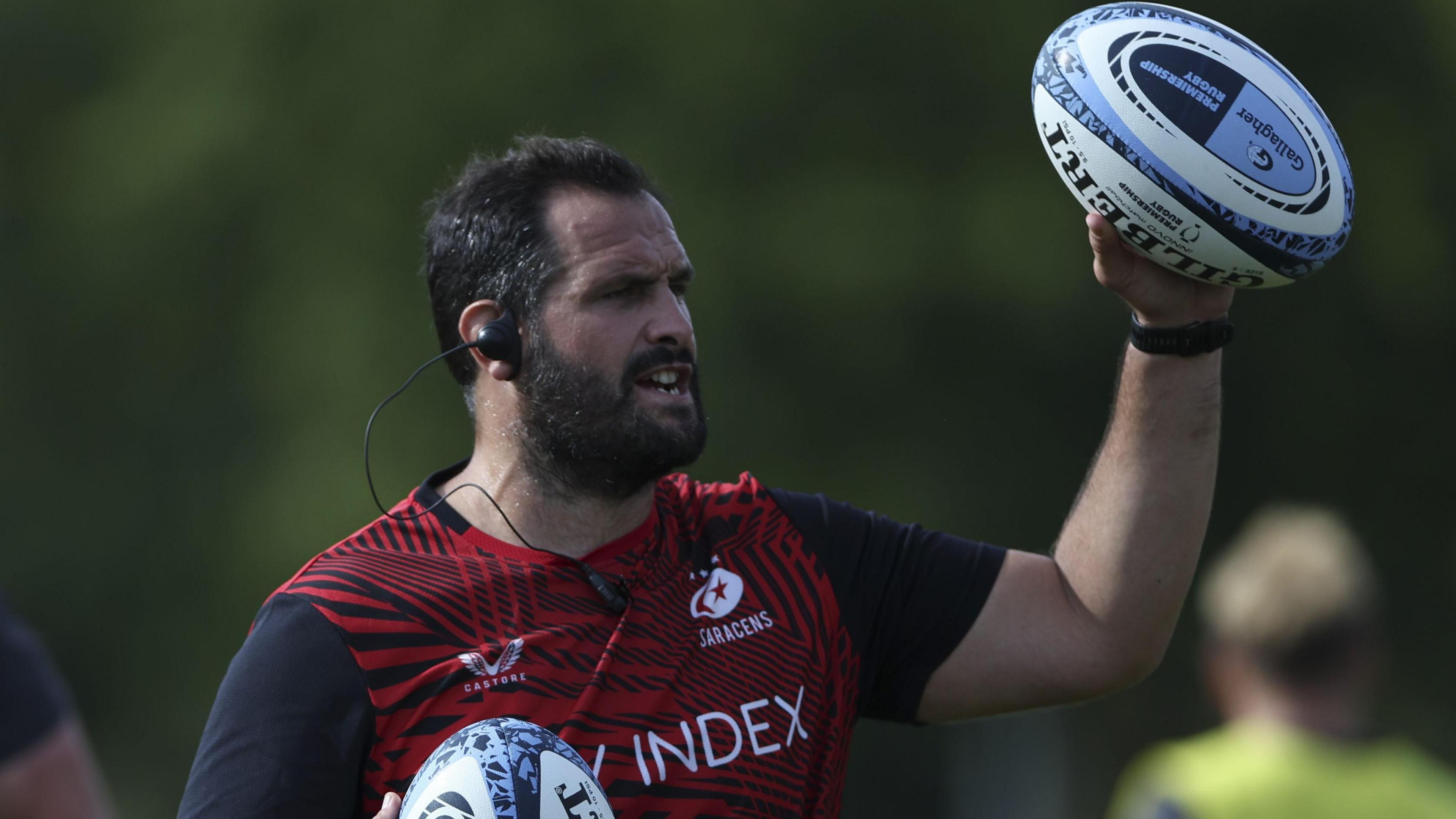 Juan Figallo prepares to throw a ball as he coaches the Saracens men's team