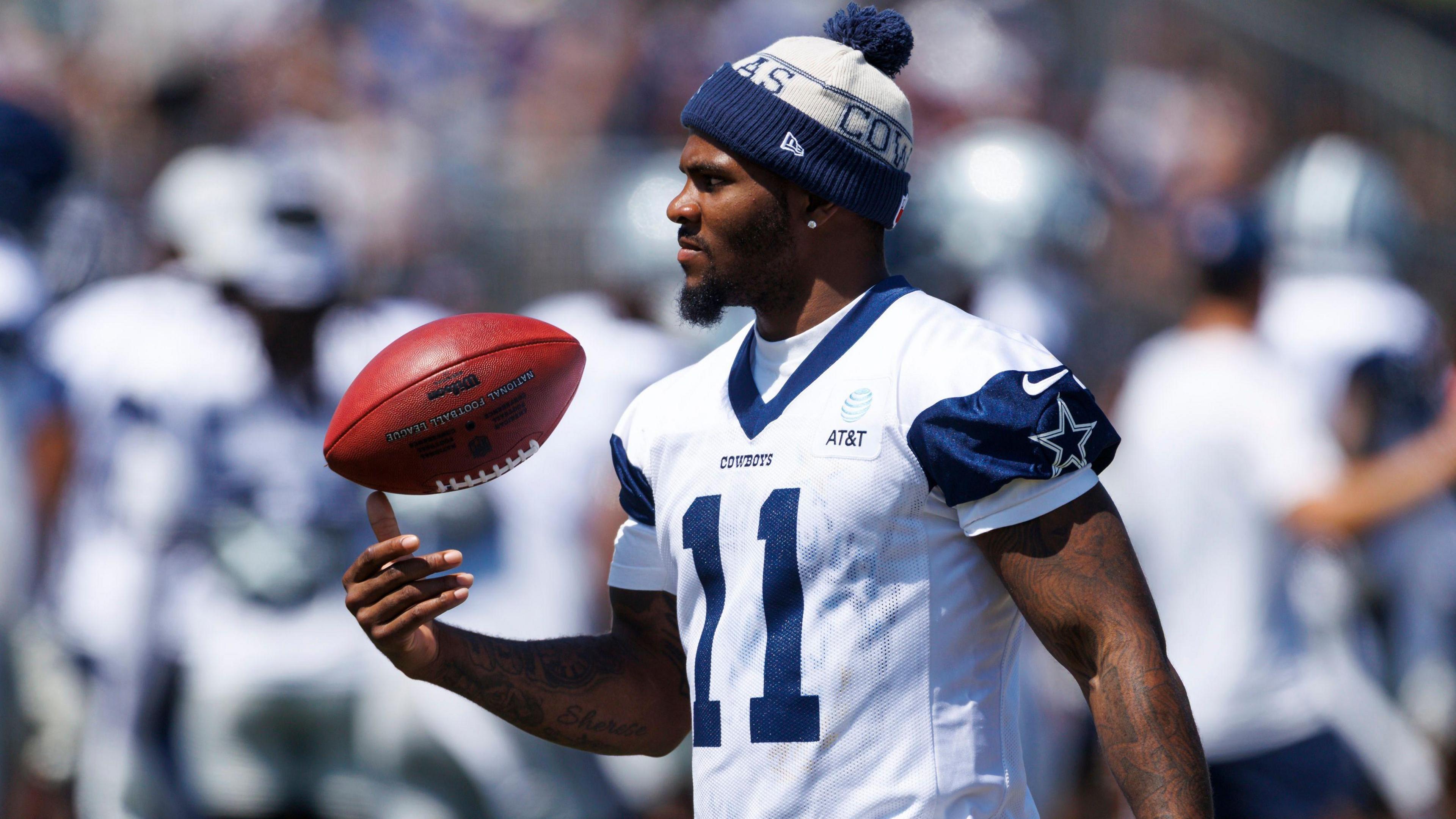 Dallas Cowboys defender Micah Parsons throws a football during practice
