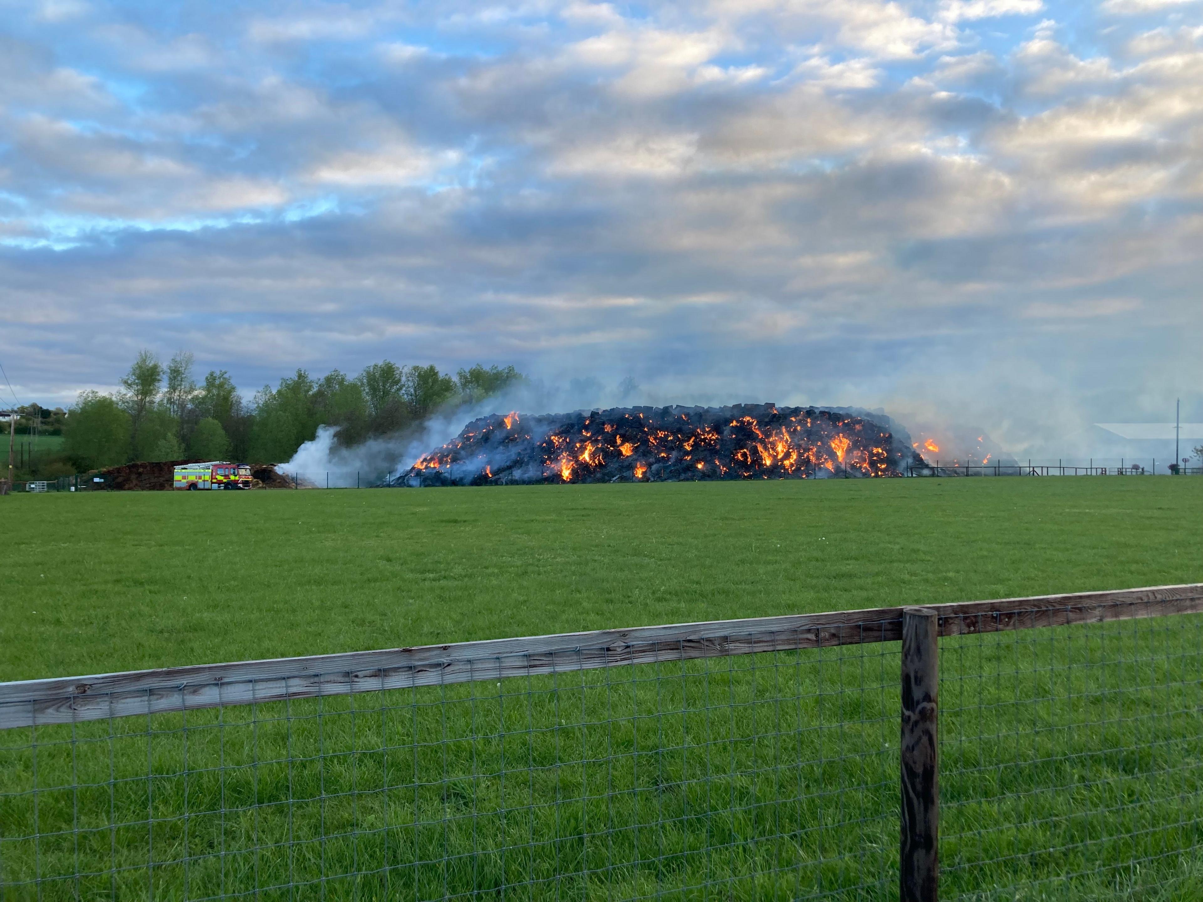 Pile of straw burning in daylight