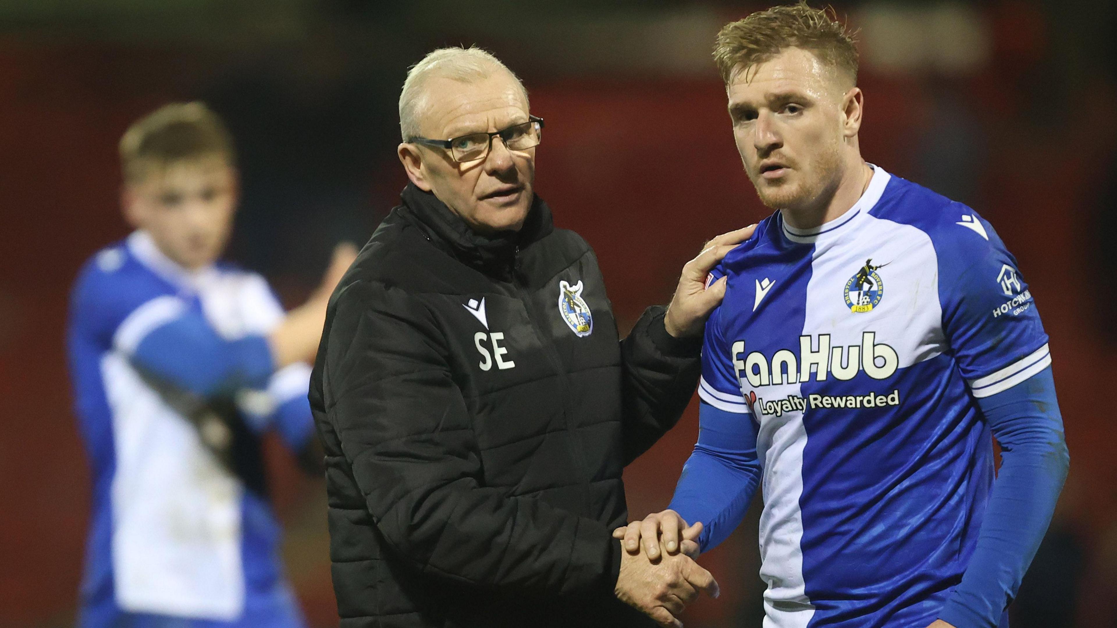 Bristol Rovers boss Steve Evans shakers the hand of one of his players following the draw with Crewe
