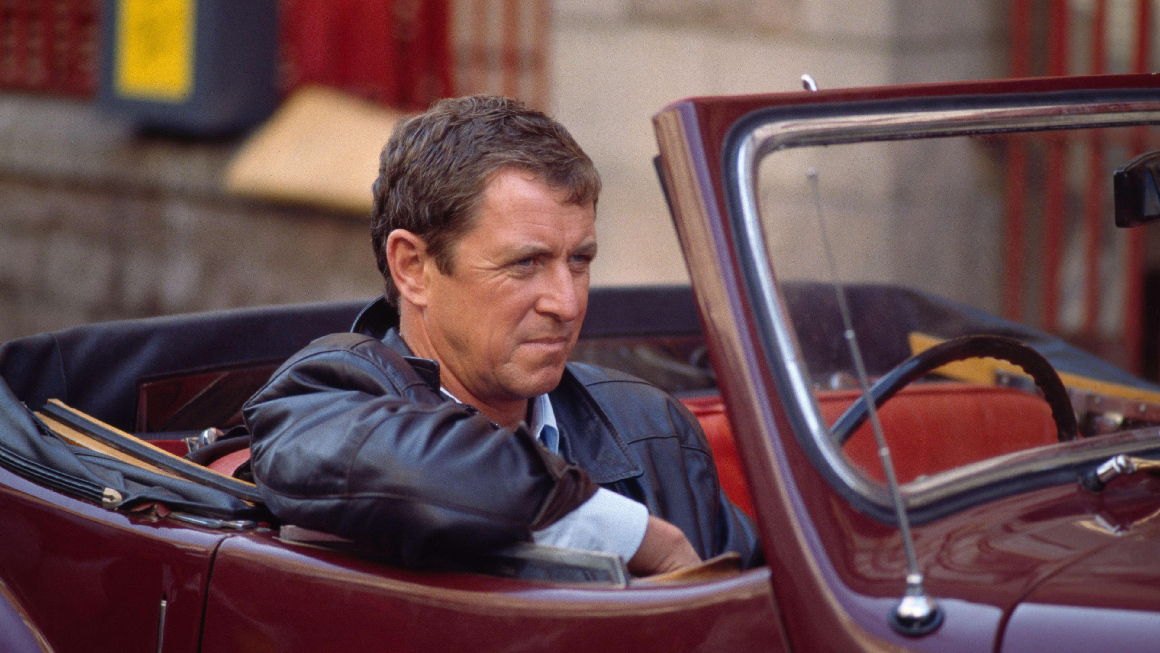 John Nettles as Jim Bergerac in Bergerac sat in a convertable car