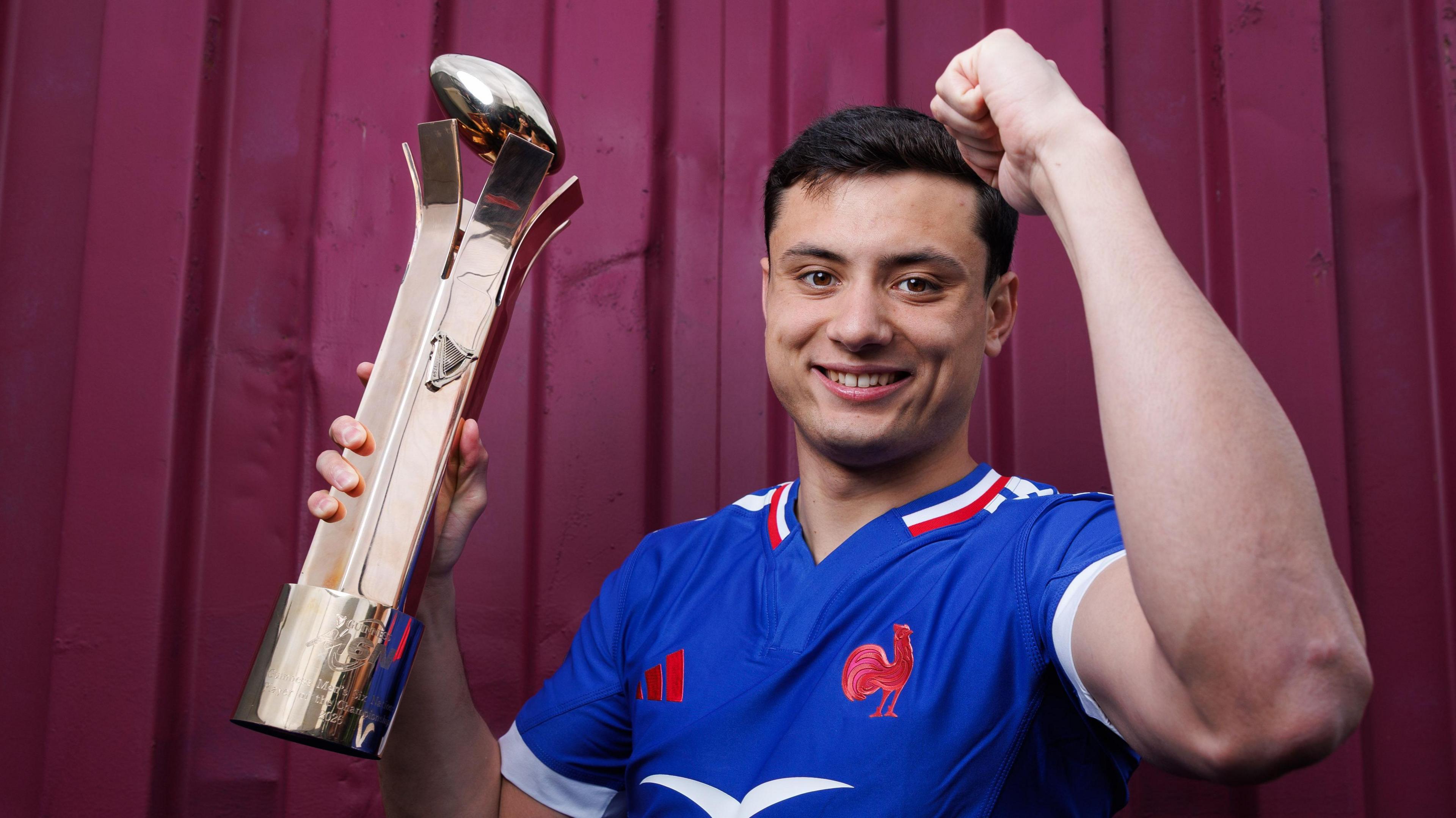 Louis Bielle-Biarrey with the player of the championship trophy