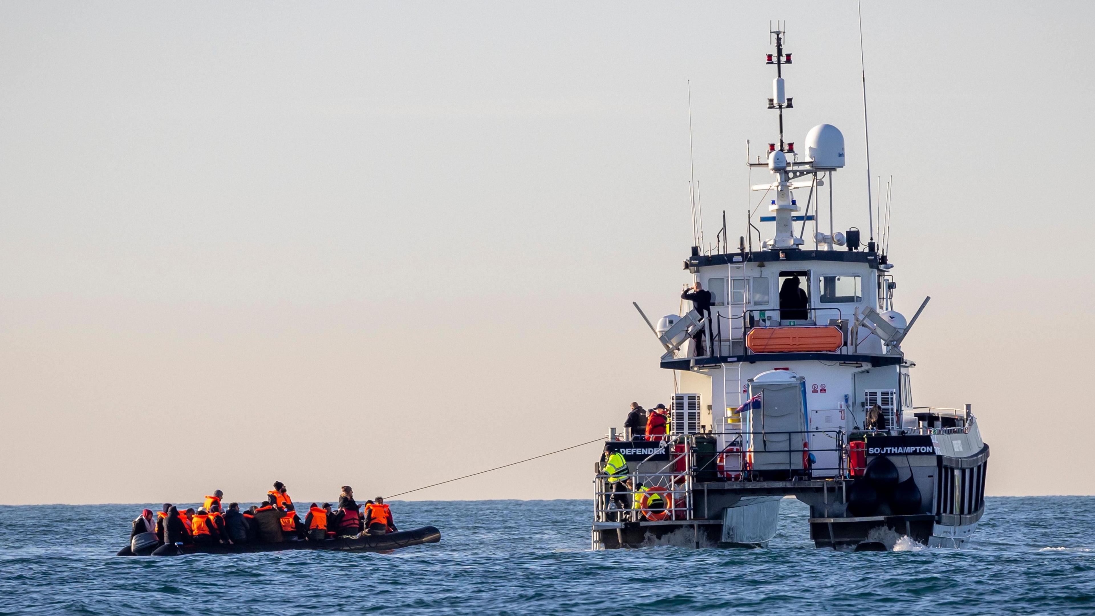 A small boat packed with people is rescued in English waters by Border Force vessel