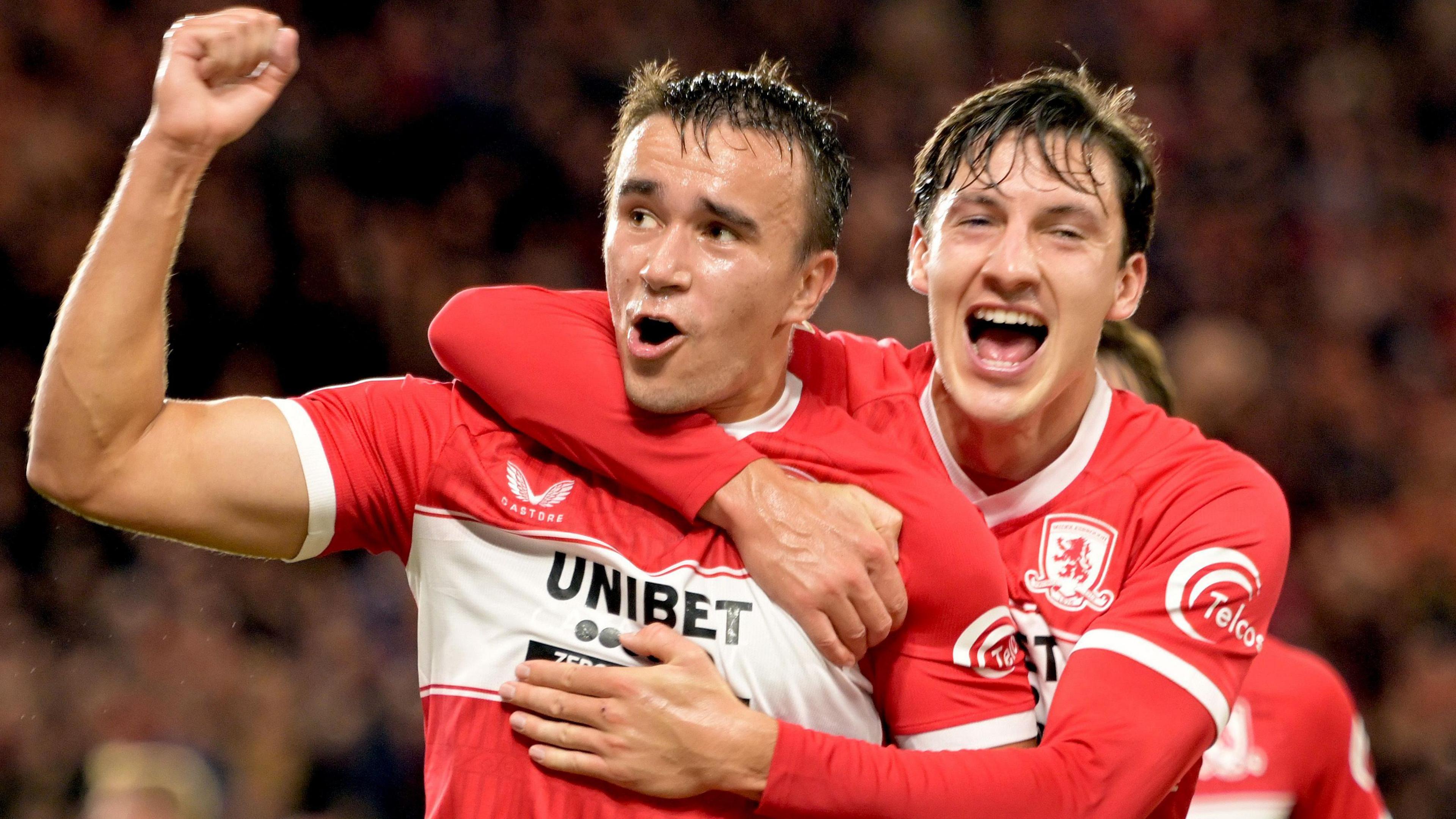 David Strelec with a raised clenched fist as he celebrates his first Middlesbrough goal with Callum Brittain 