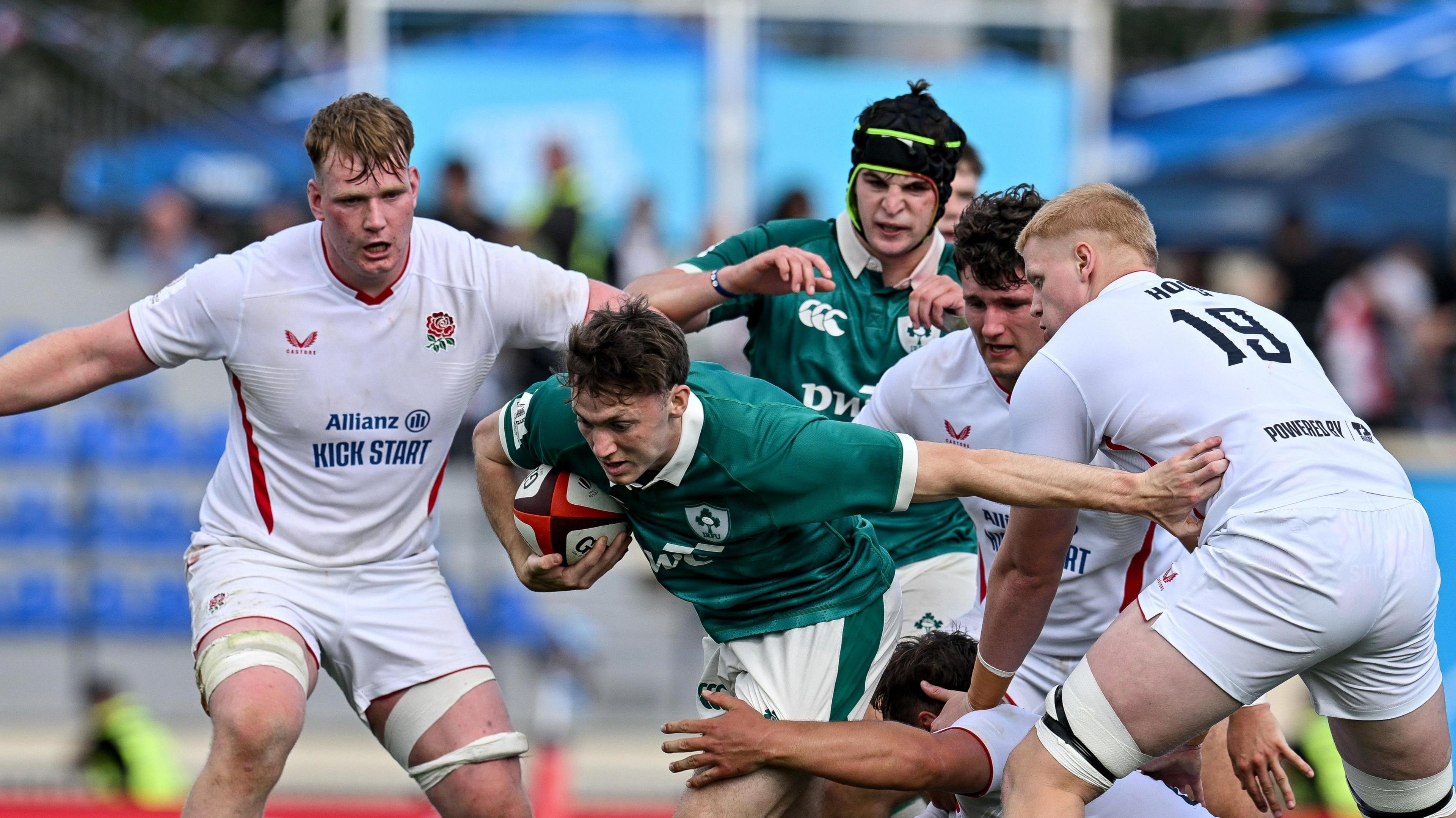 Tom Wood is tackled by England players
