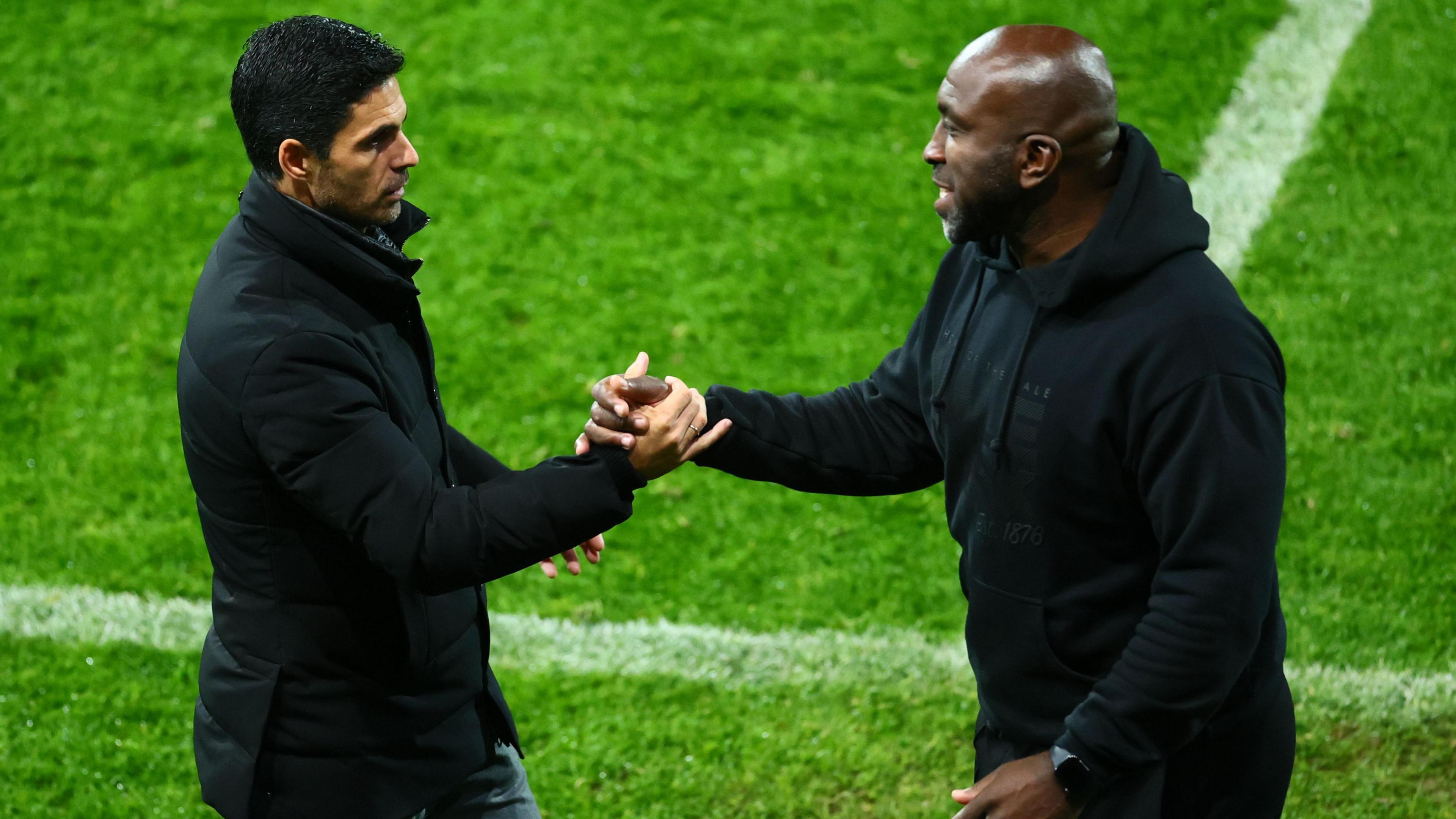 Arsenal head coach Mikel Arteta and Port Vale manager Darren Moore shake hands at the end of the Gunner's 2-0 Carabao Cup win