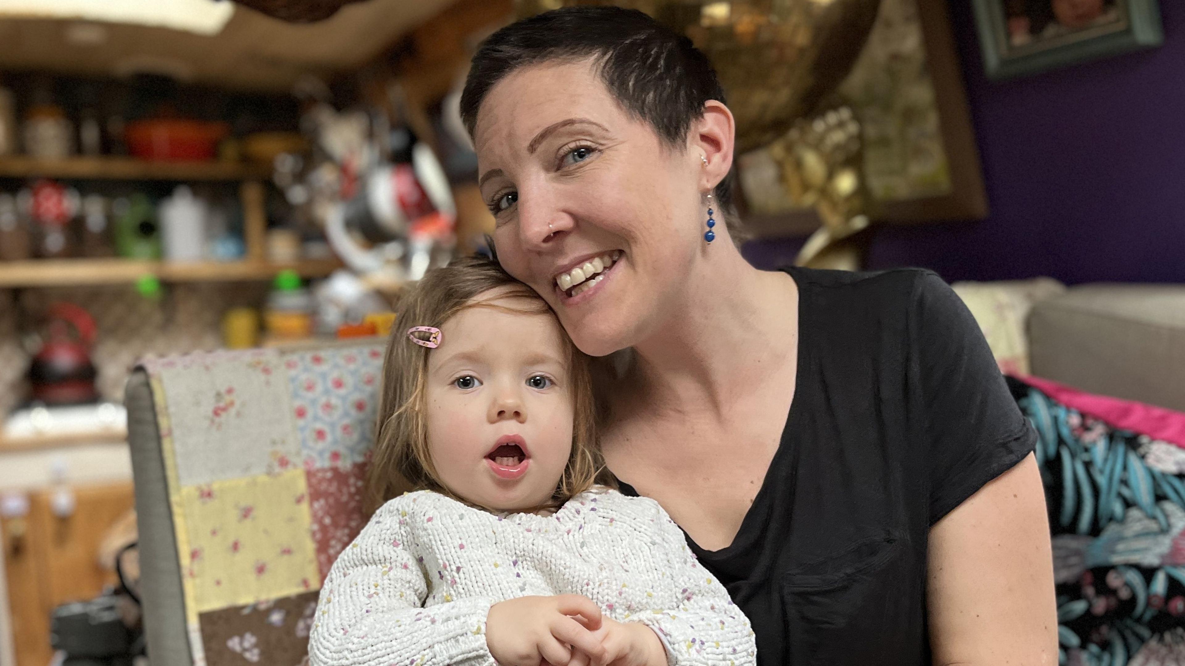 Live-aboard boater, Mary Maw, with her two-year-old daughter, Cybil