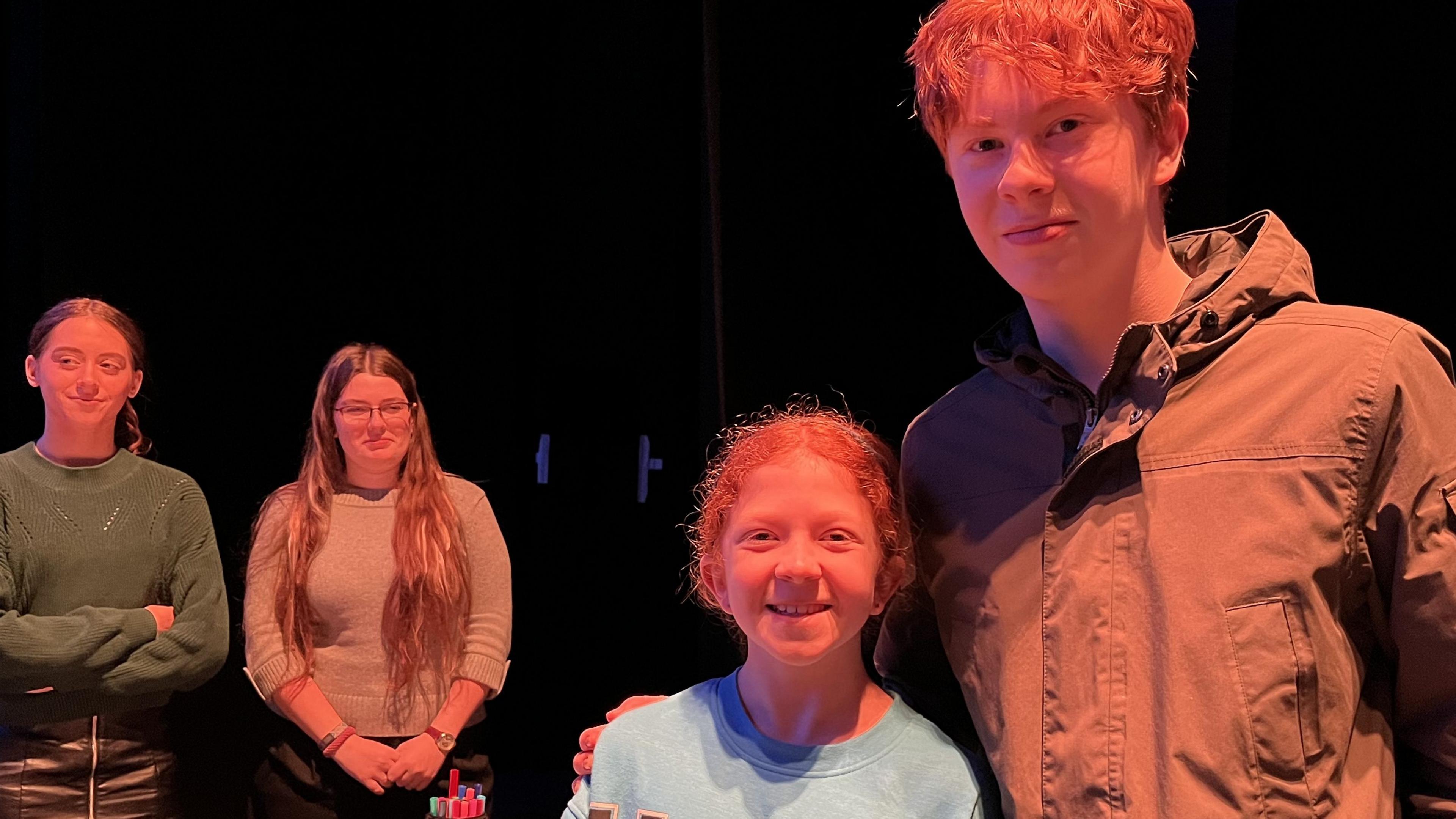 Edward, 14, with his arm around Olivia, 10