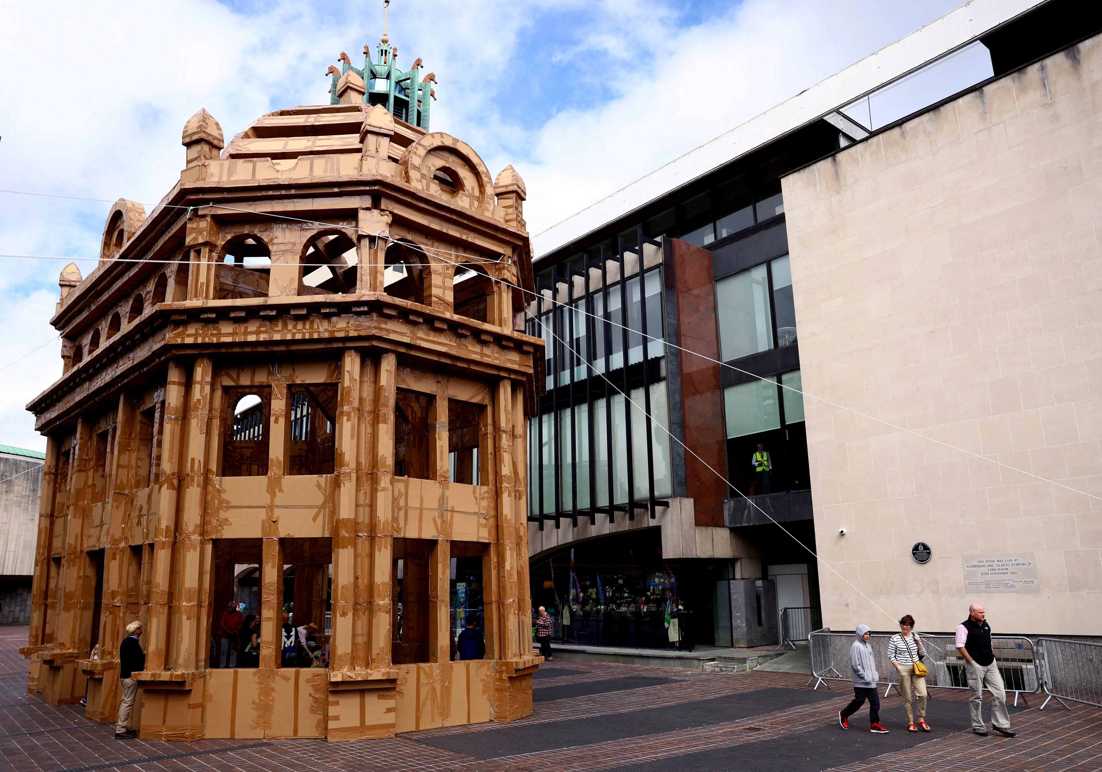 People visit a building made entirely from cardboard boxes designed by French artist Olivier Grossetete, which forms part of the Novum Summer Festival in Newcastle, Britain August 12, 2023.