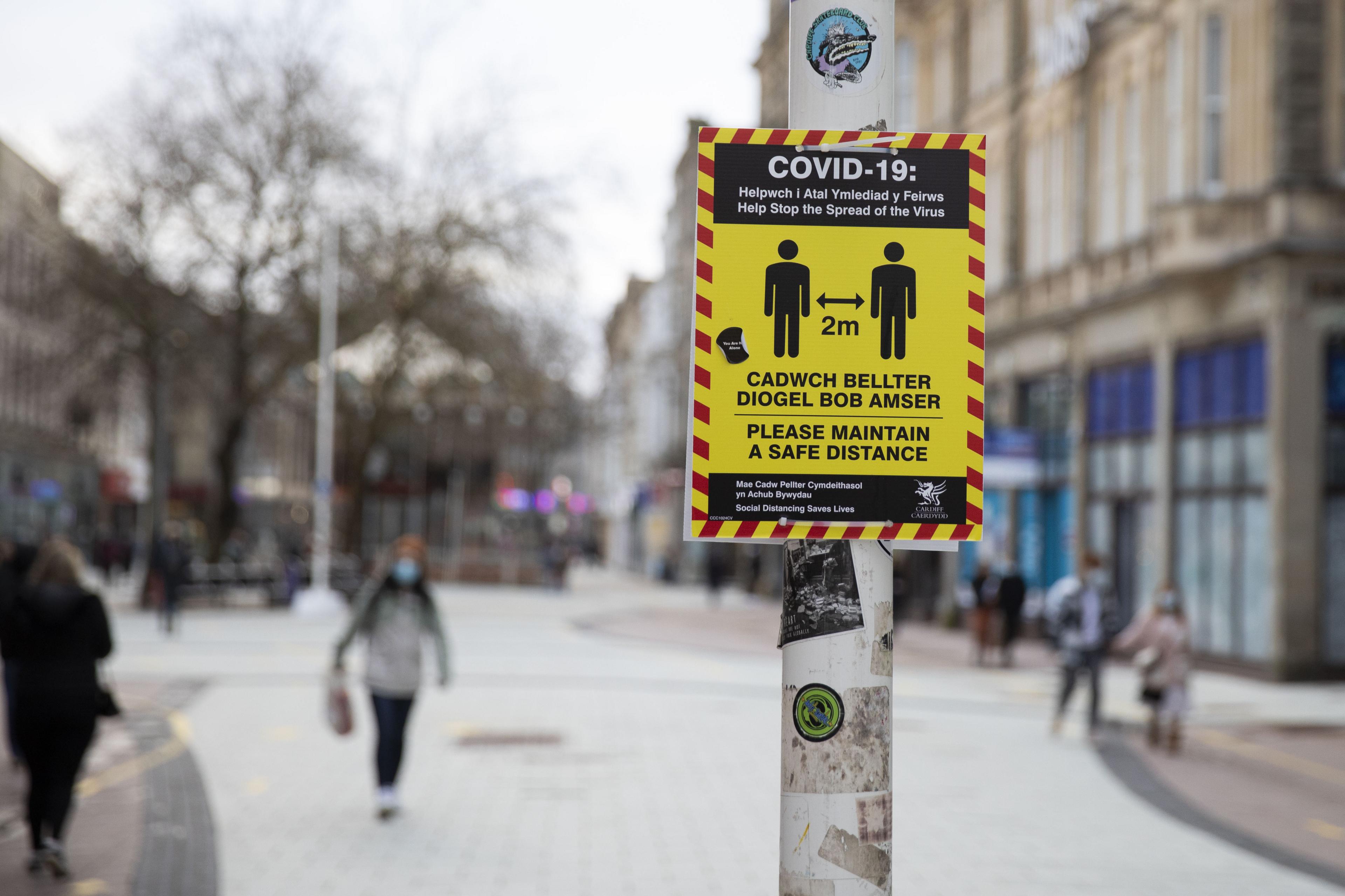 A sign with Covid restrictions in Cardiff's city centre during lcokdown