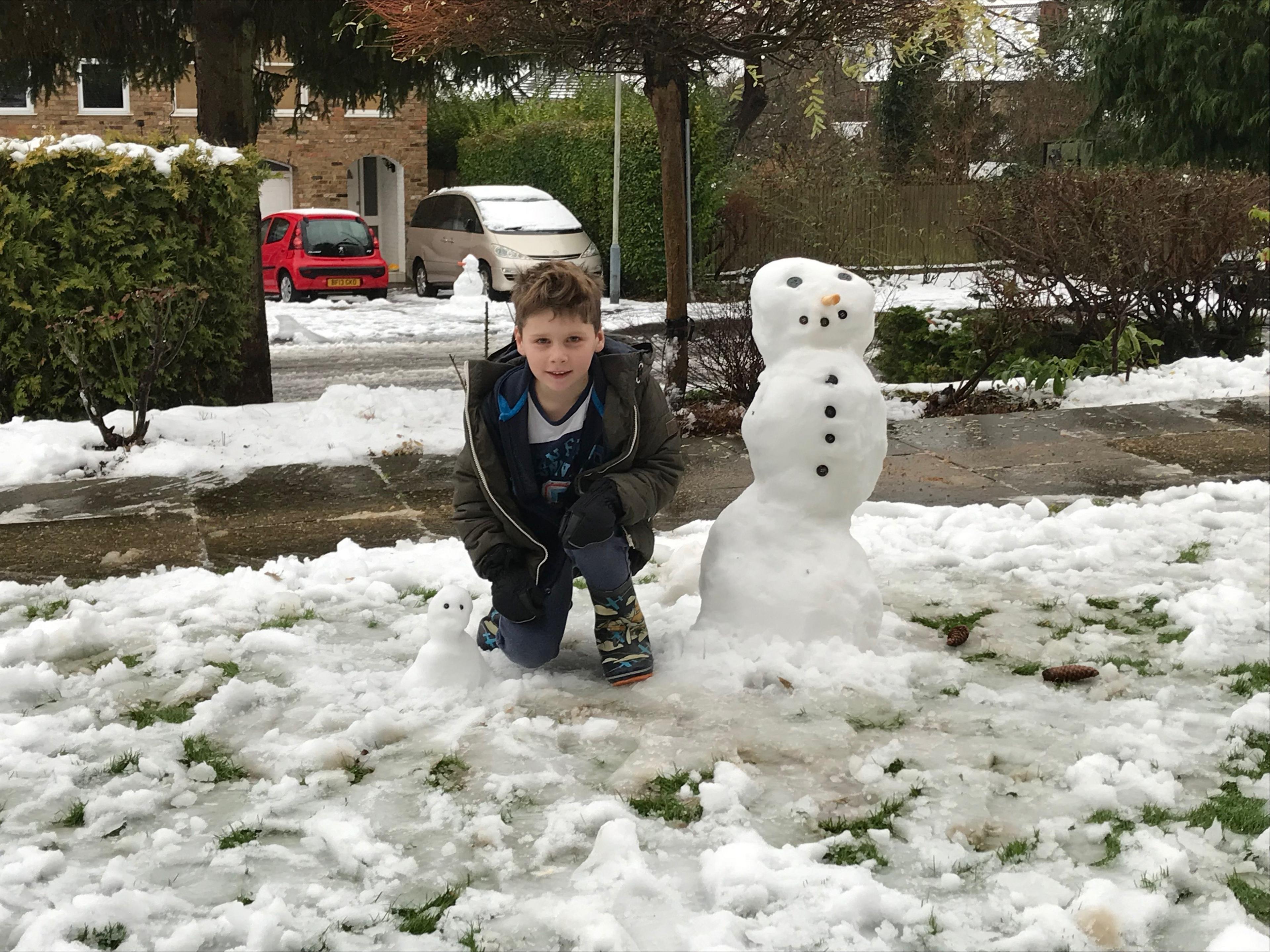 Ethan and his snowman and snowdog