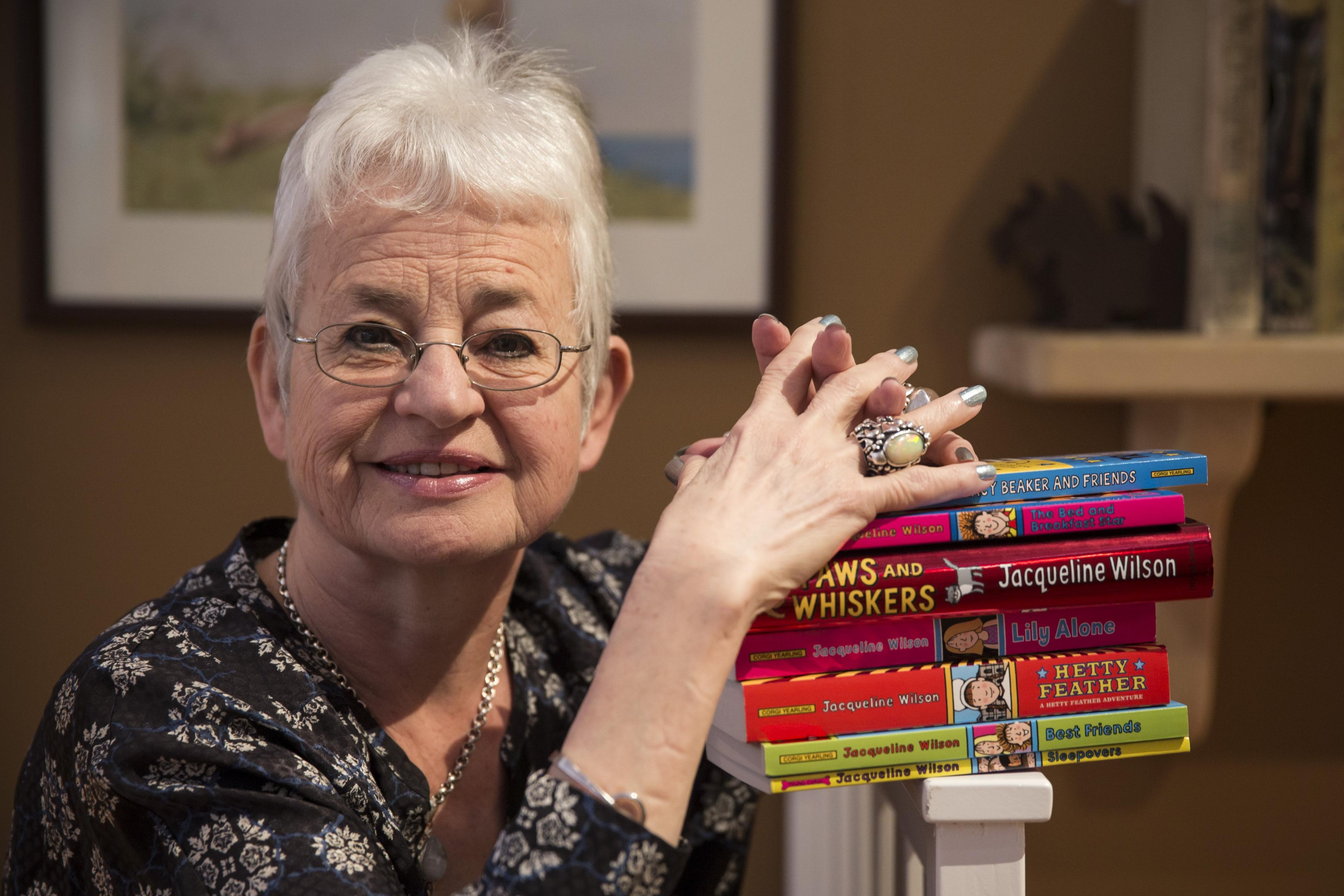 Jacqueline-wilson-sat-with-books