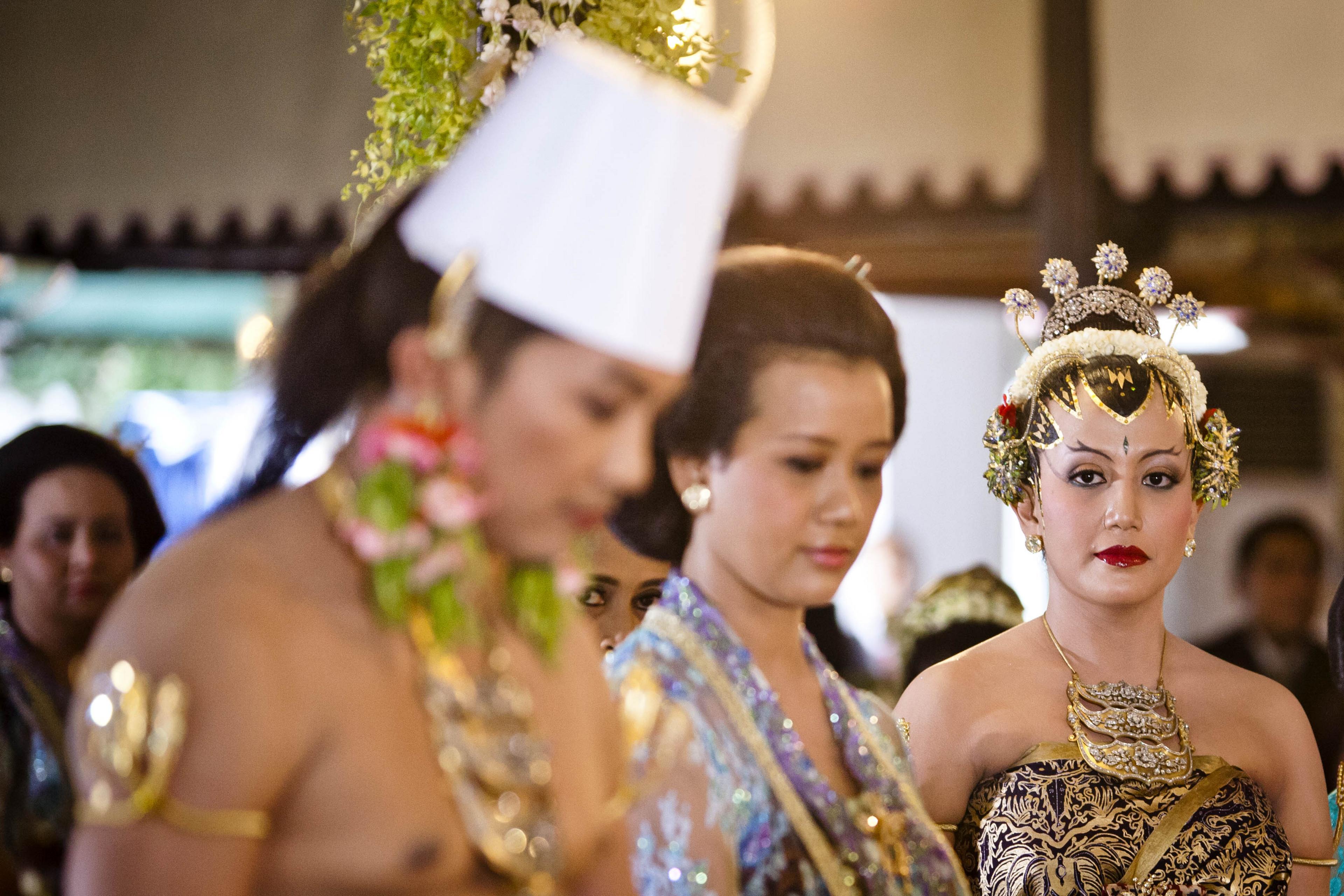 Eldest daughter in middle and her younger sister on her wedding day