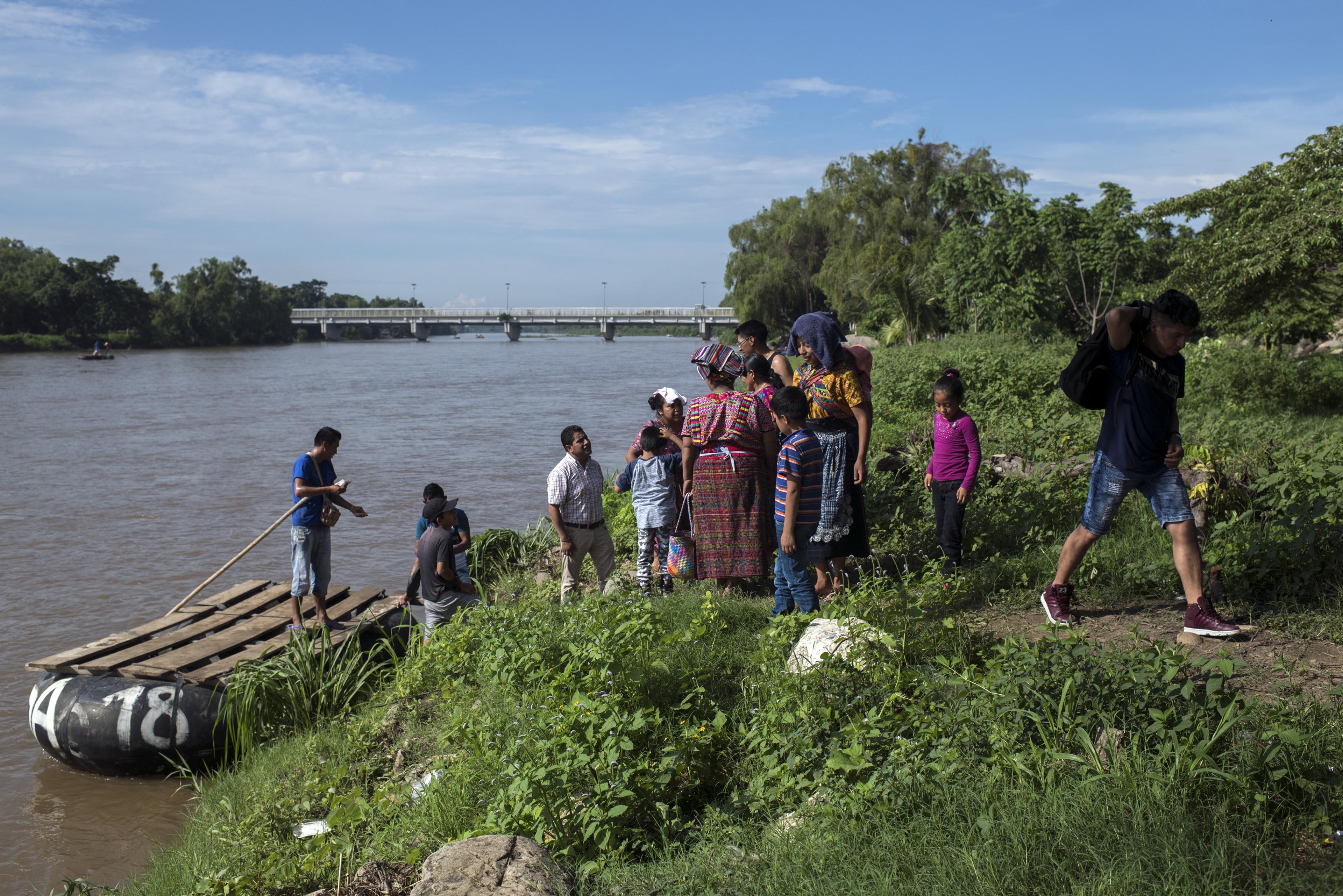 Migrants arrive in Mexico after crossing the Suchiate River