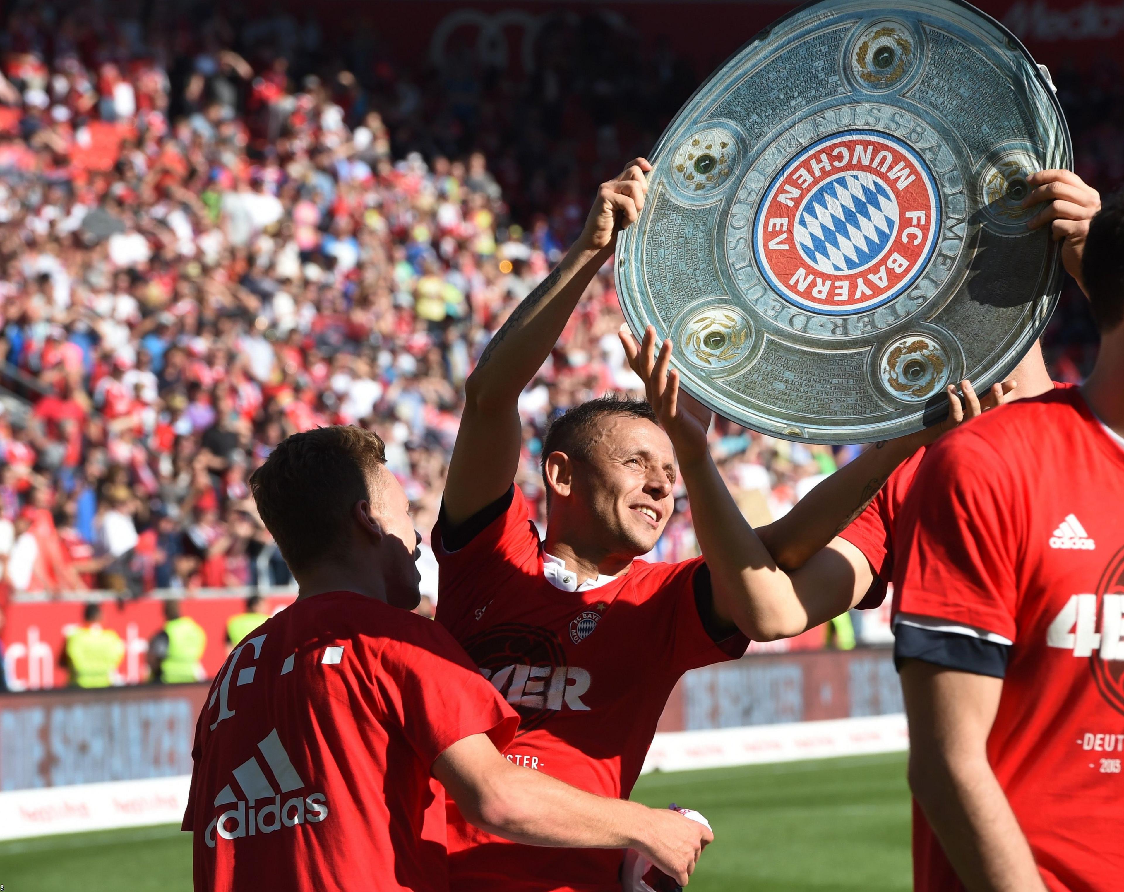 Bayern Munich players celebrate winning the Bundesliga title