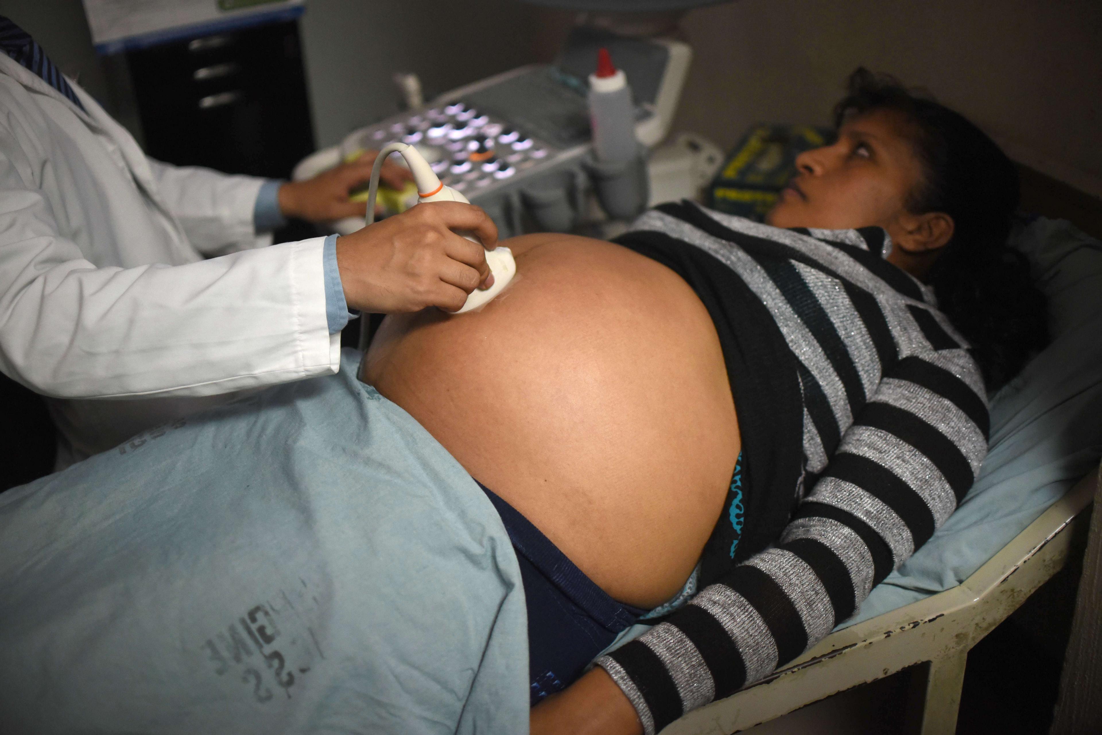 A pregnant woman gets an ultrasound at a maternity ward in Guatemala City.