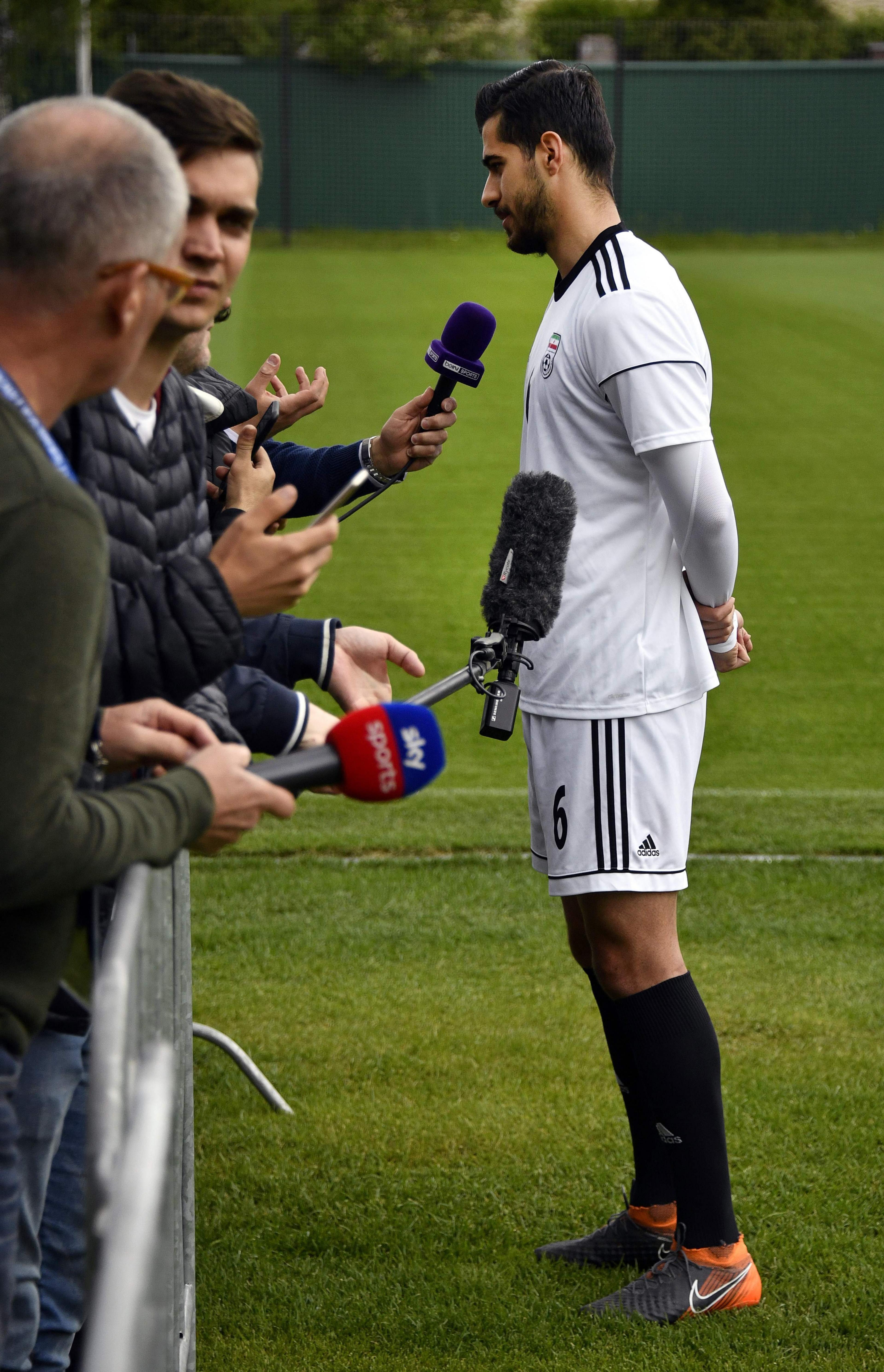 Iran's midfielder Saeid Ezatolahi speaks to the press upon his arrival to take part in a training session in Bakovka, outside Moscow, on 10 June 2018, ahead of the Russia 2018 World Cup.