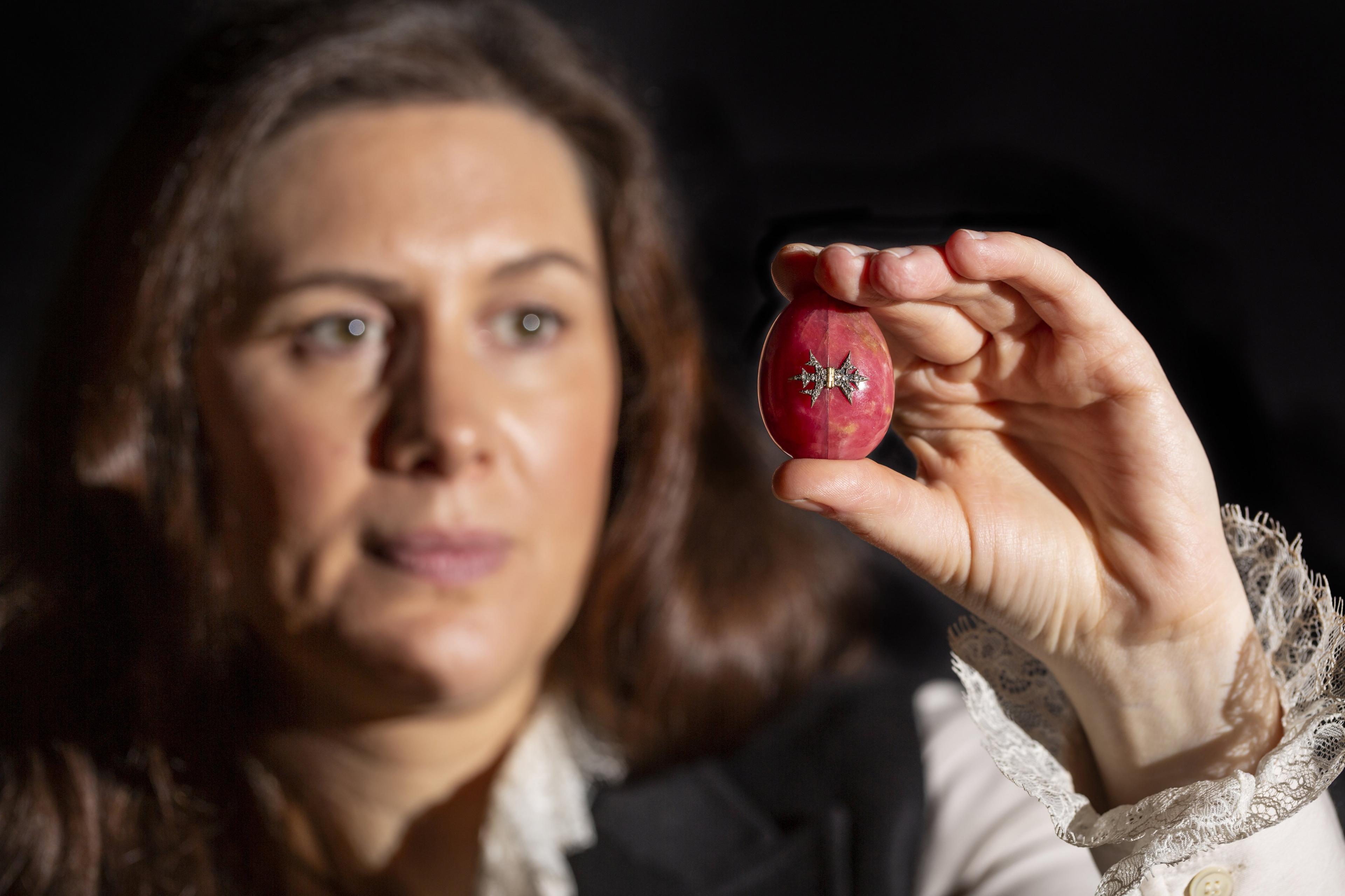 Curator Alice Strickland with Fabergé egg at Polesden Lacey