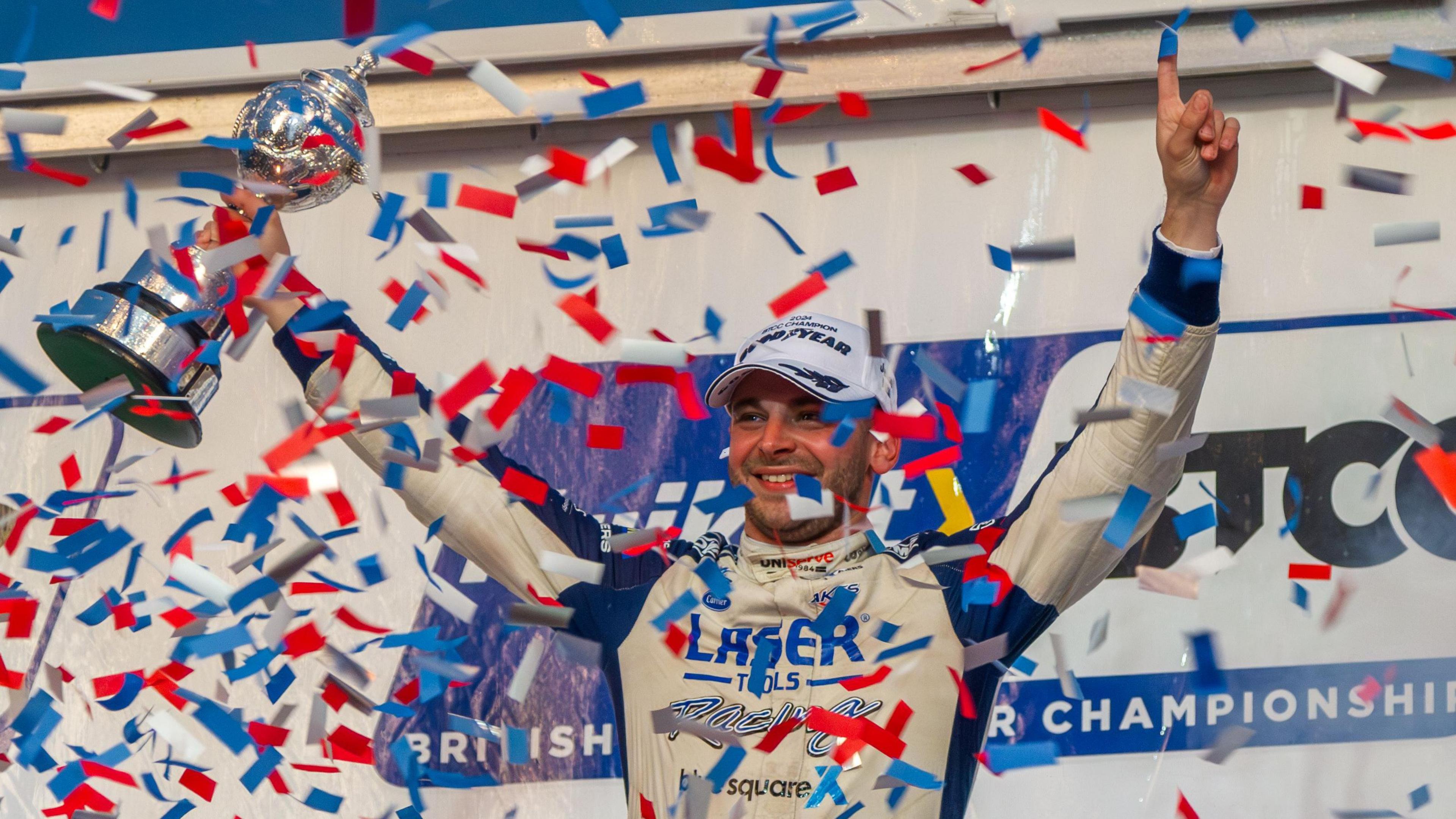 Jake Hill celebrates with his BTCC trophy and confetti