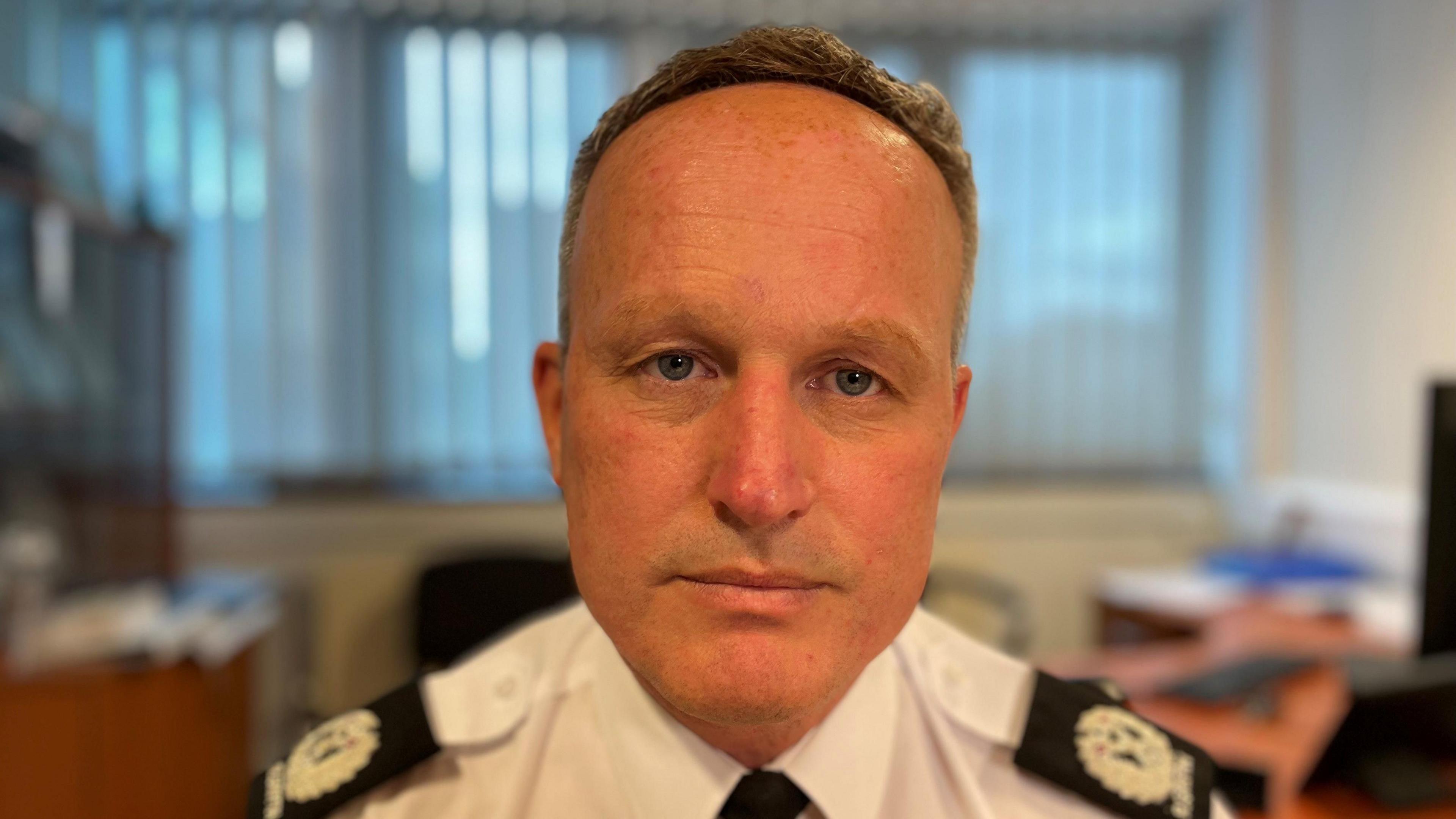 A policeman head and shoulders shot